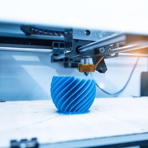 Up close of modern 3d printer. Image Credit: asharkyu/Shutterstock.com