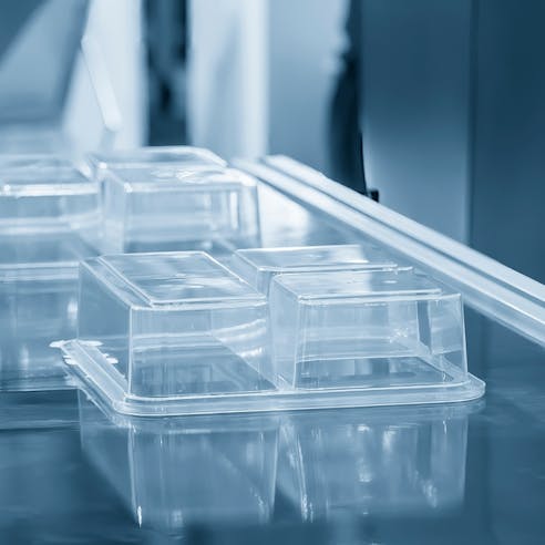 Plastic container manufacturing. Image Credit: Shutterstock.com/Pixel B