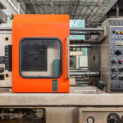 Close-up of an injection molding machine. Image Credit: Shutterstock.com/saoirse2013