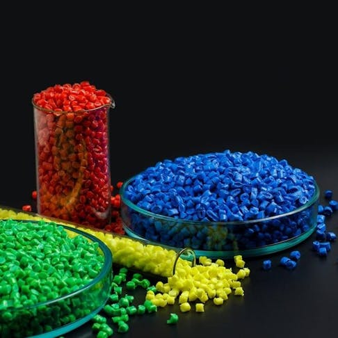 Blue, yellow, red granules of polypropylene, polyamide. Image Credit: Anastasiia Burlutskaia/Shutterstock.com