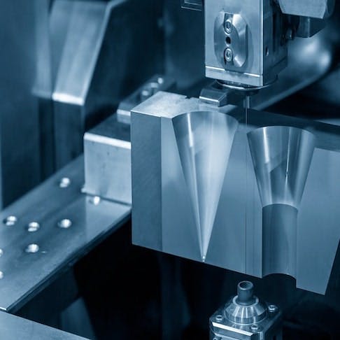 Die insert cutting process by wire cut machine controlled by CNC - Image credit: Shutterstock/Pixel B