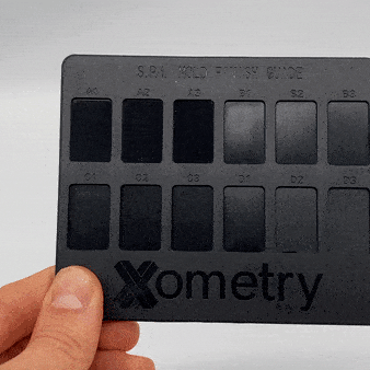 Animated gif of an injection molded finish sample card reflecting light at different angles