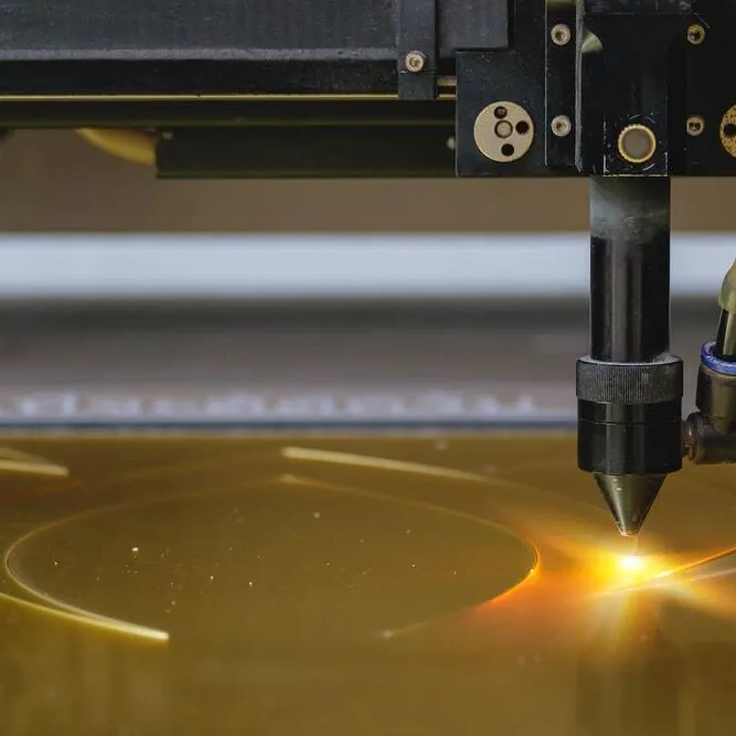 Laser cutting on plastic board. image Credit: Shutterstock.com/John99
