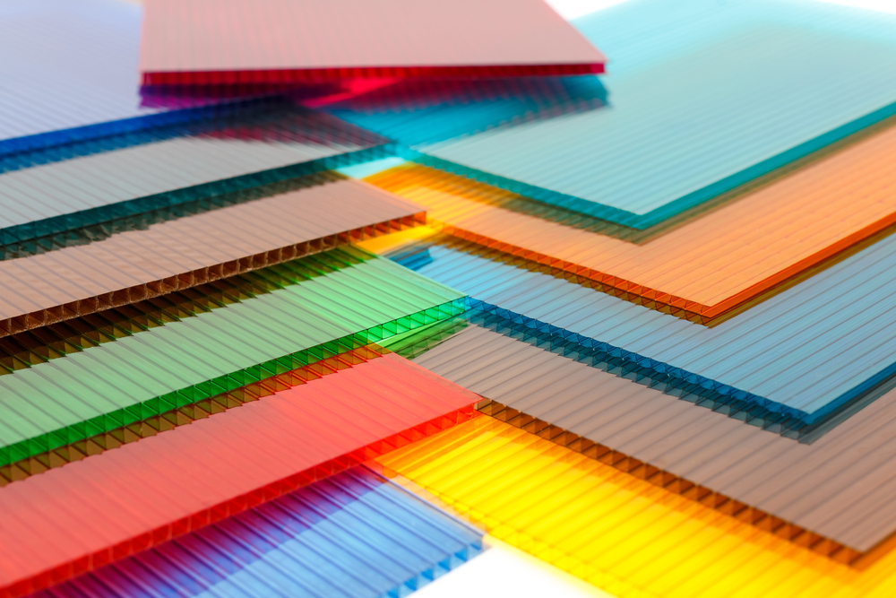 Polycarbonate Vs Acrylic What To Know About These Different Plastics   F5d63915 5df6 46a3 91ba 968705e33940 Colorful Stack Of Polycarbonate Sheets 