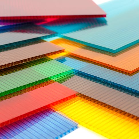 Colorful stack of polycarbonate sheets. Image Credit: Shutterstock.com/Cat Us