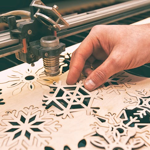 Laser cut stencil snowflakes. Image Credit: Shutterstock.com/Skylines