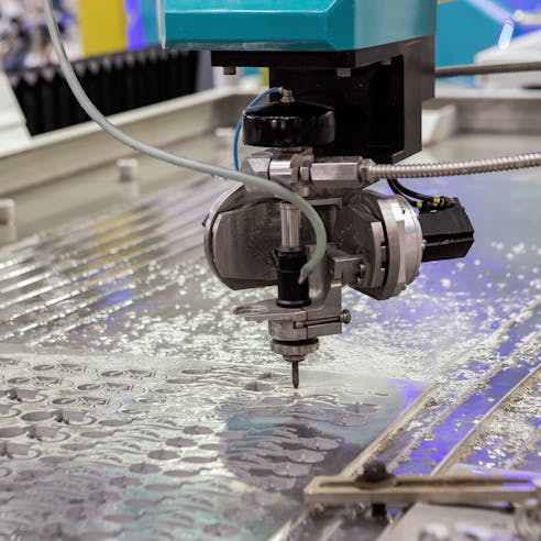 A water jet cutting machine at work