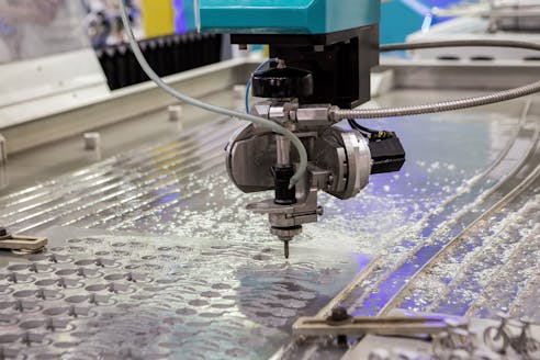 A water jet cutting machine at work