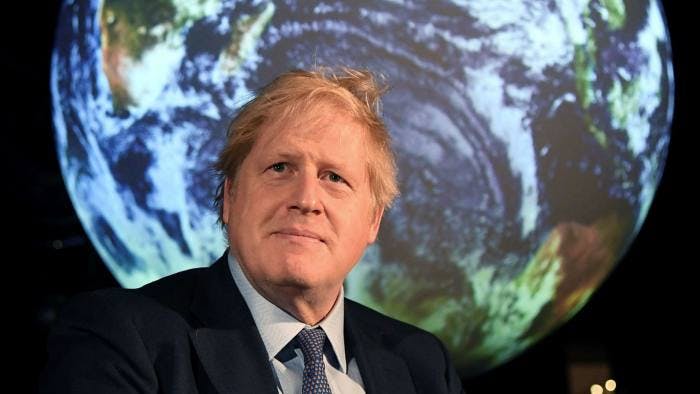 Boris Johnson standing in front of a map of the world (Image: Financial Times)