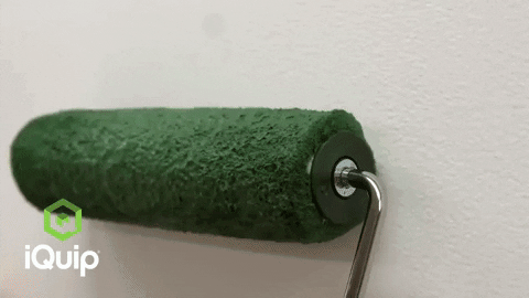 Rolling paint brush GIF, rolling green paint onto a wall with the caption 'smooth rolling'