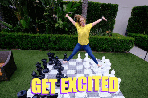 Girl in yellow shirt jumping with the caption 'get excited'