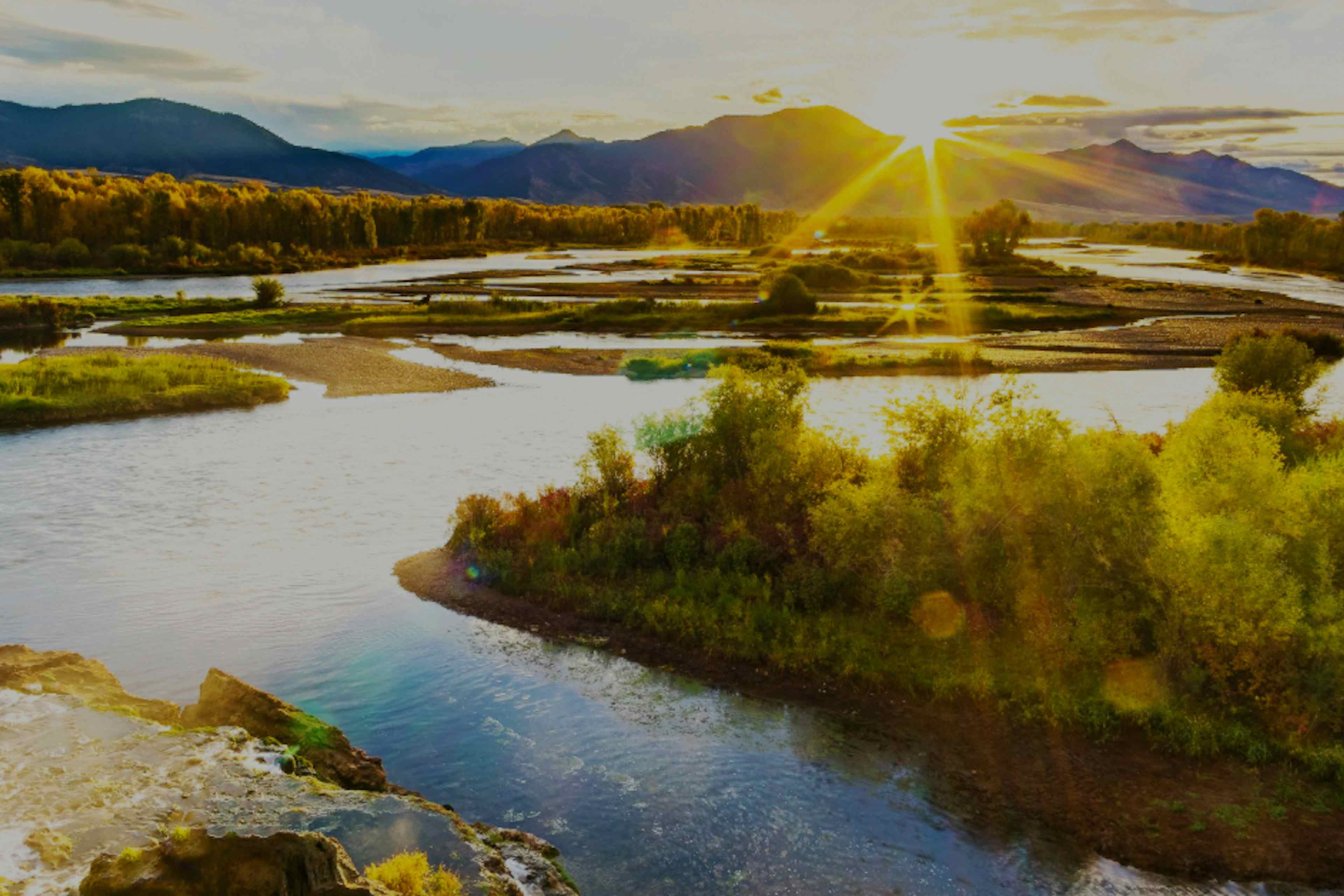 The sun rises over Swan Valley, ID and the South Fork of the Snake River.