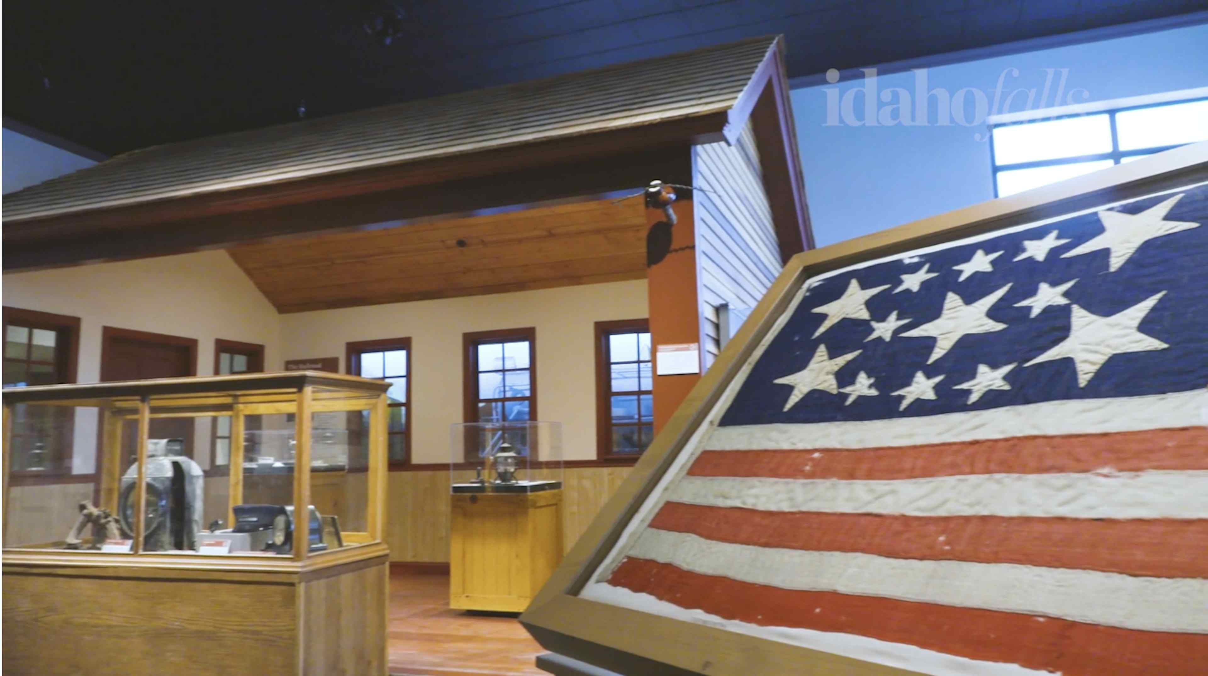 Picture of american history part of museum with part of a 200 year old flag in the photo