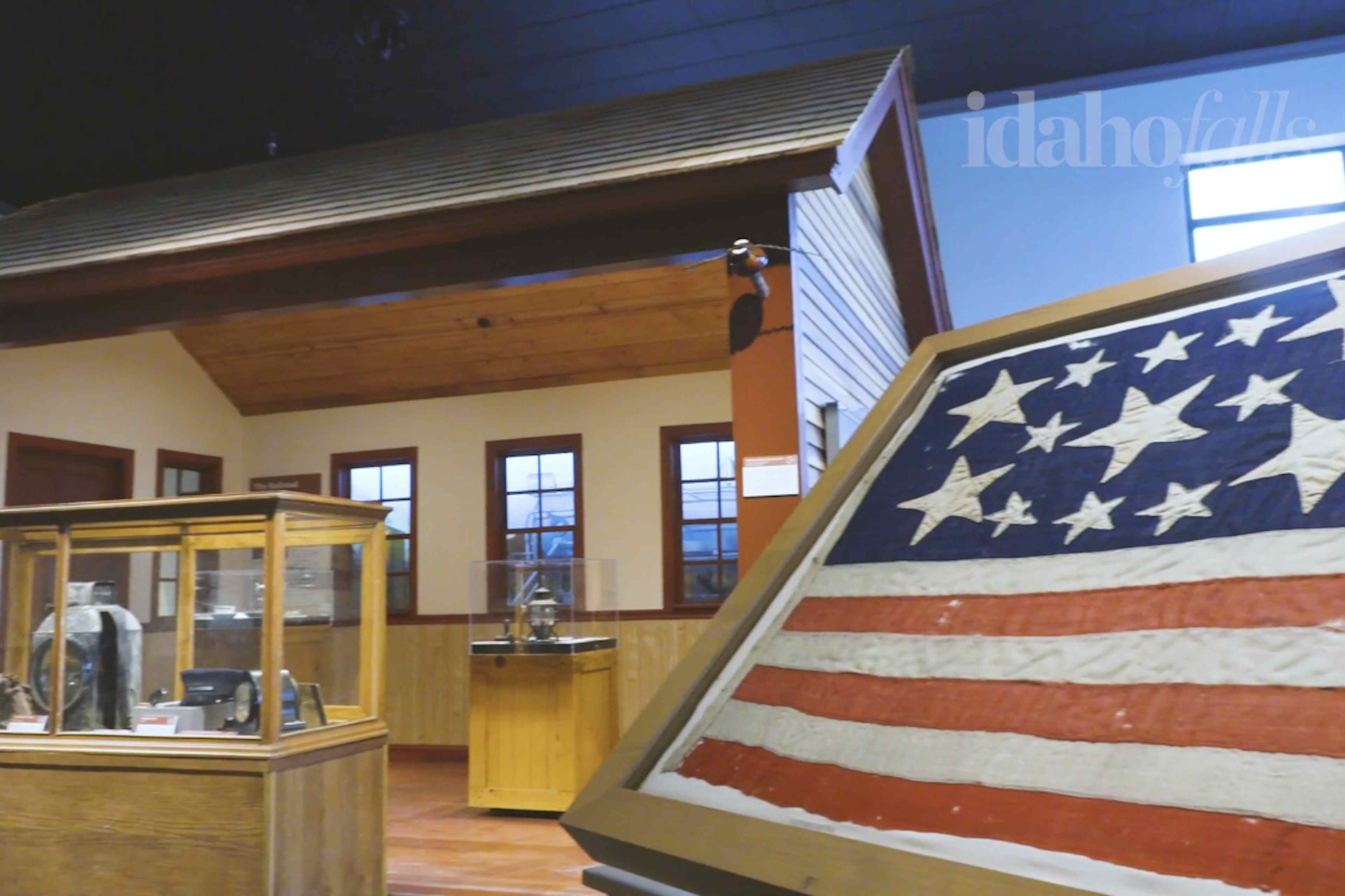 Picture of american history part of museum with part of a 200 year old flag in the photo