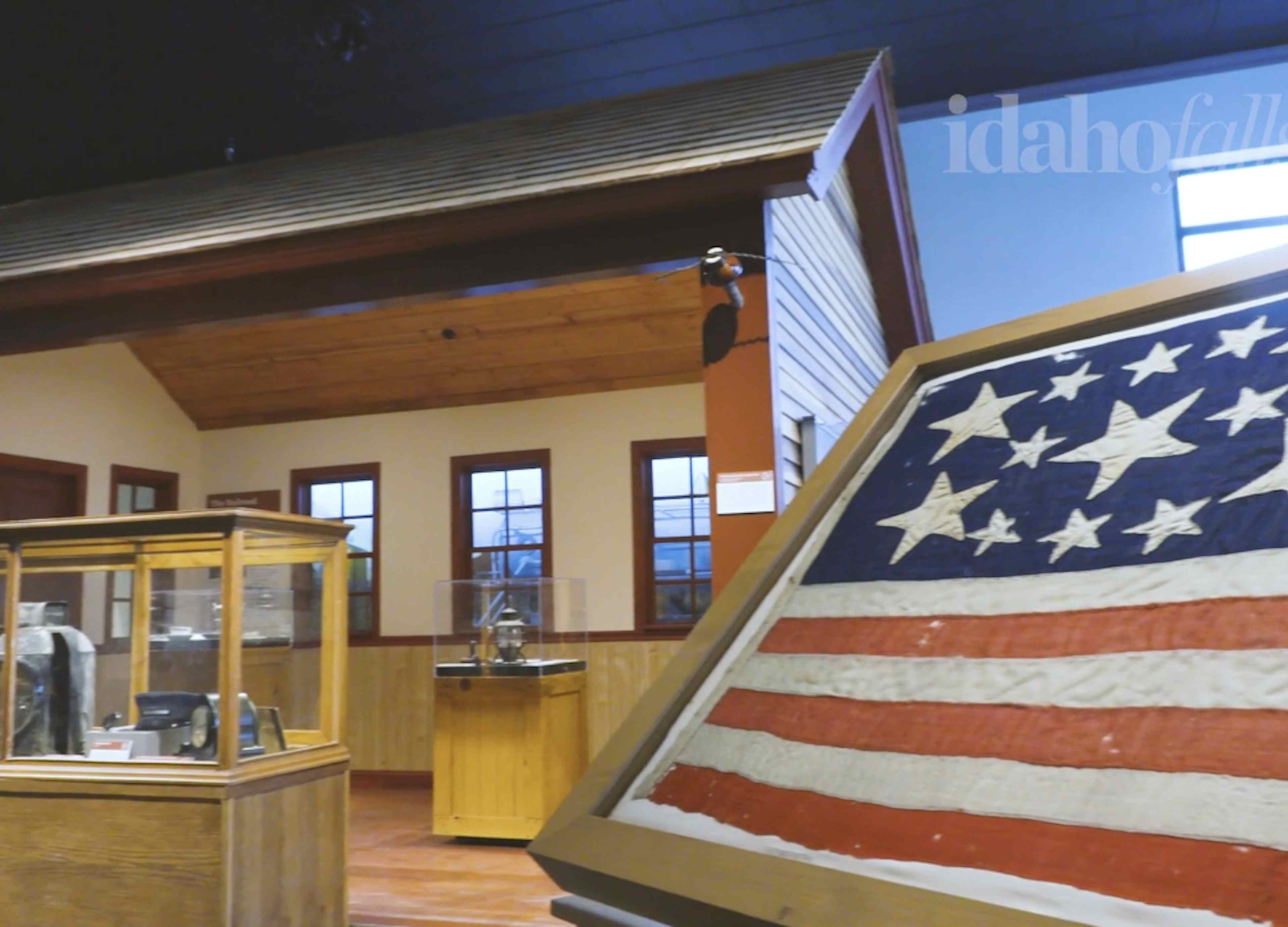 Picture of american history part of museum with part of a 200 year old flag in the photo