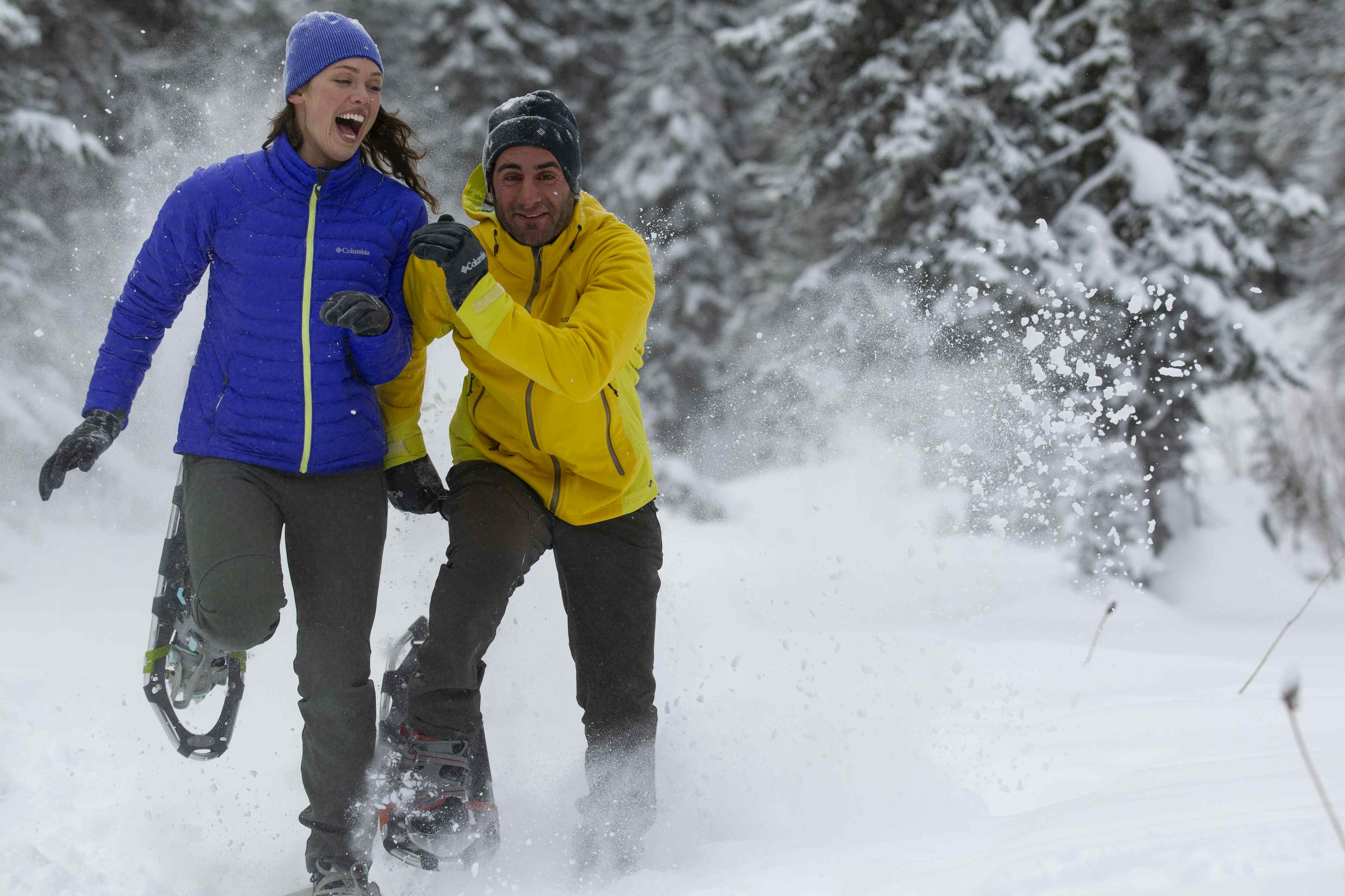 Couple flirting while running in snow shoes