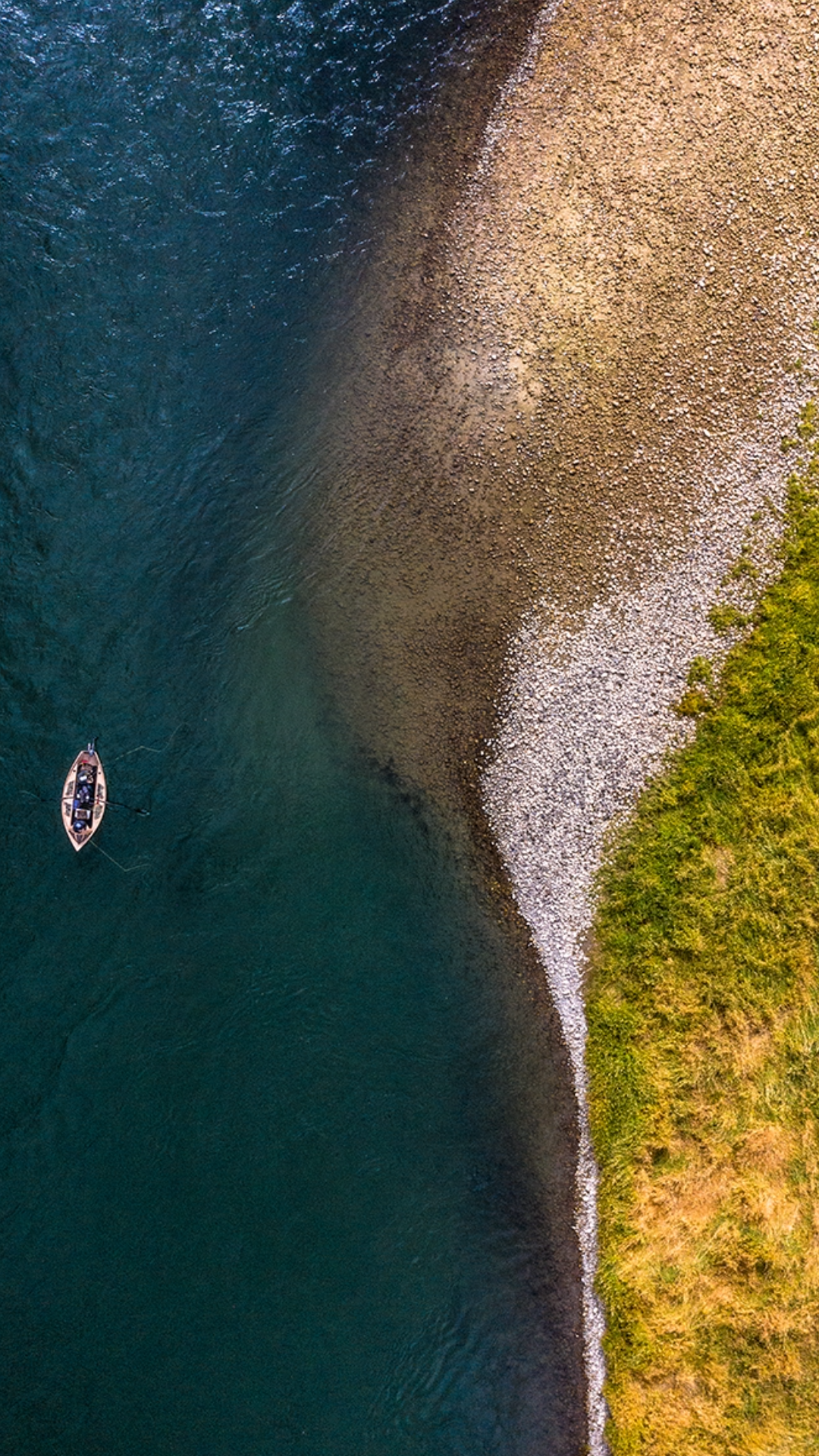 Aerial view of fishermen and boat on the South Fork of the Snake River at Palisades Dam in Swan Valley, Idaho.