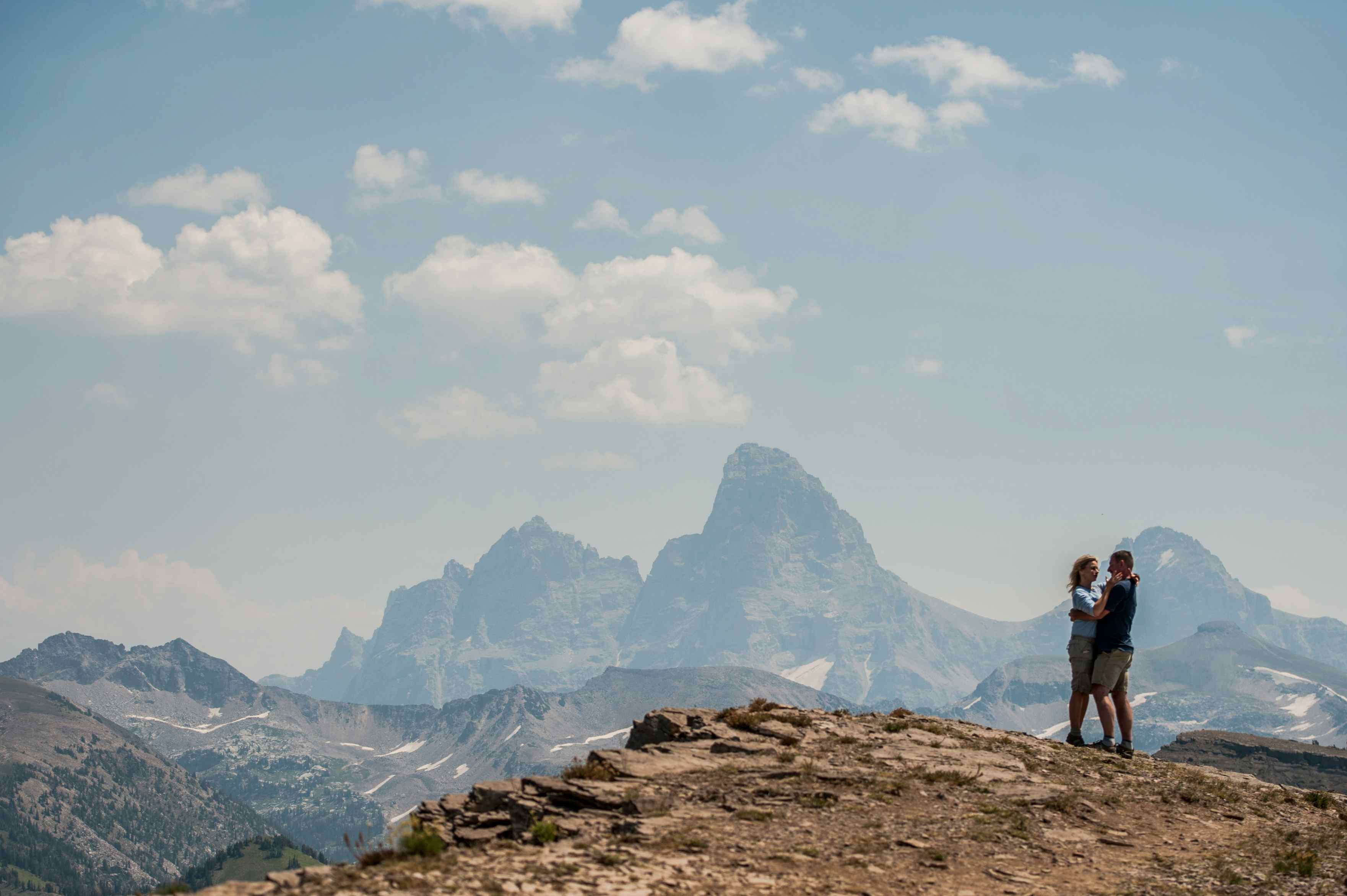 Standing in front of the Teton Mountain Range featuring the Grand Teton in Teton Valley and Eastern Idaho.