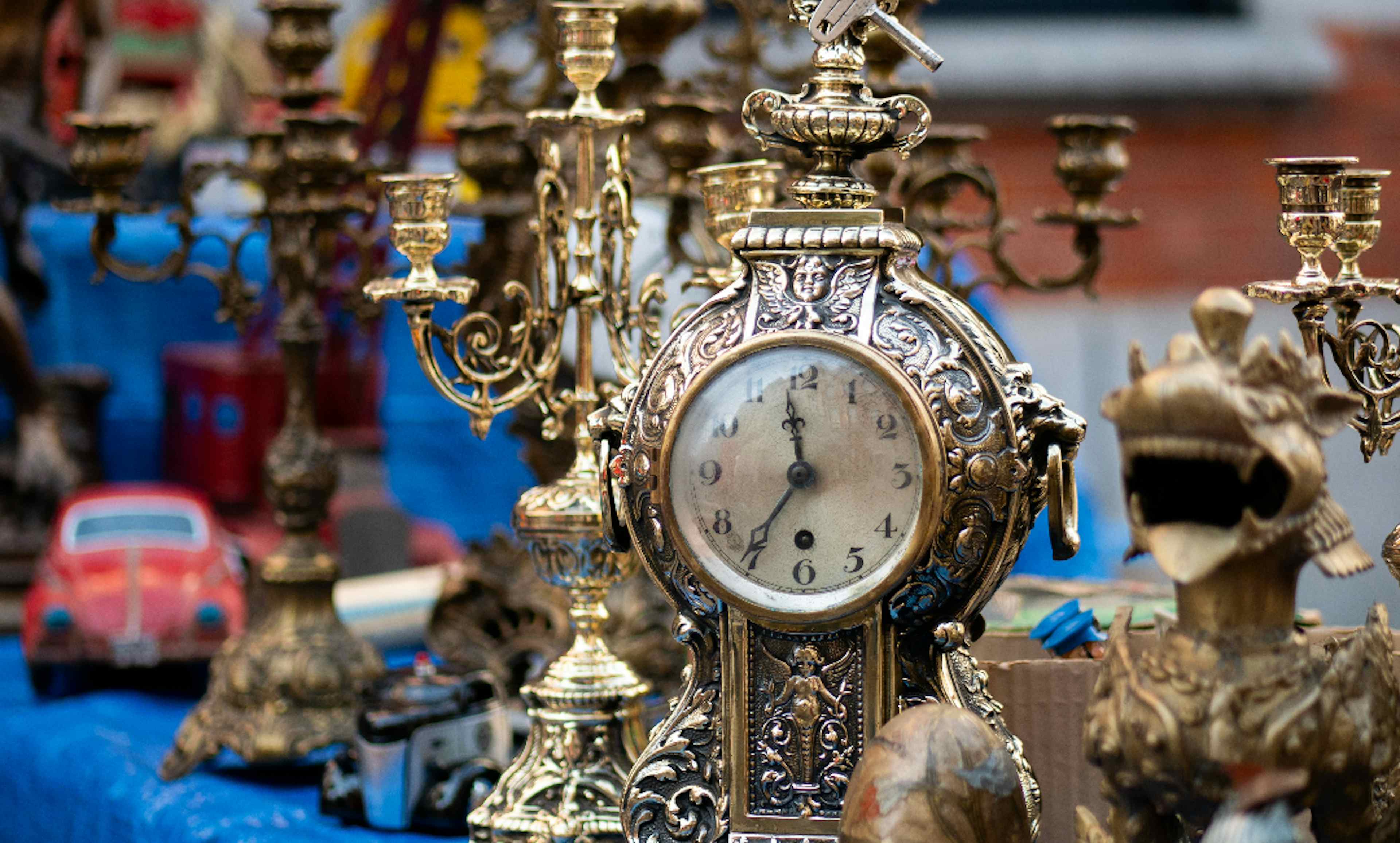 Beautiful brass and golden vintage desktop clocks offered at Vintage Market Days of Blackfoot of the Yellowstone Teton Territory. 