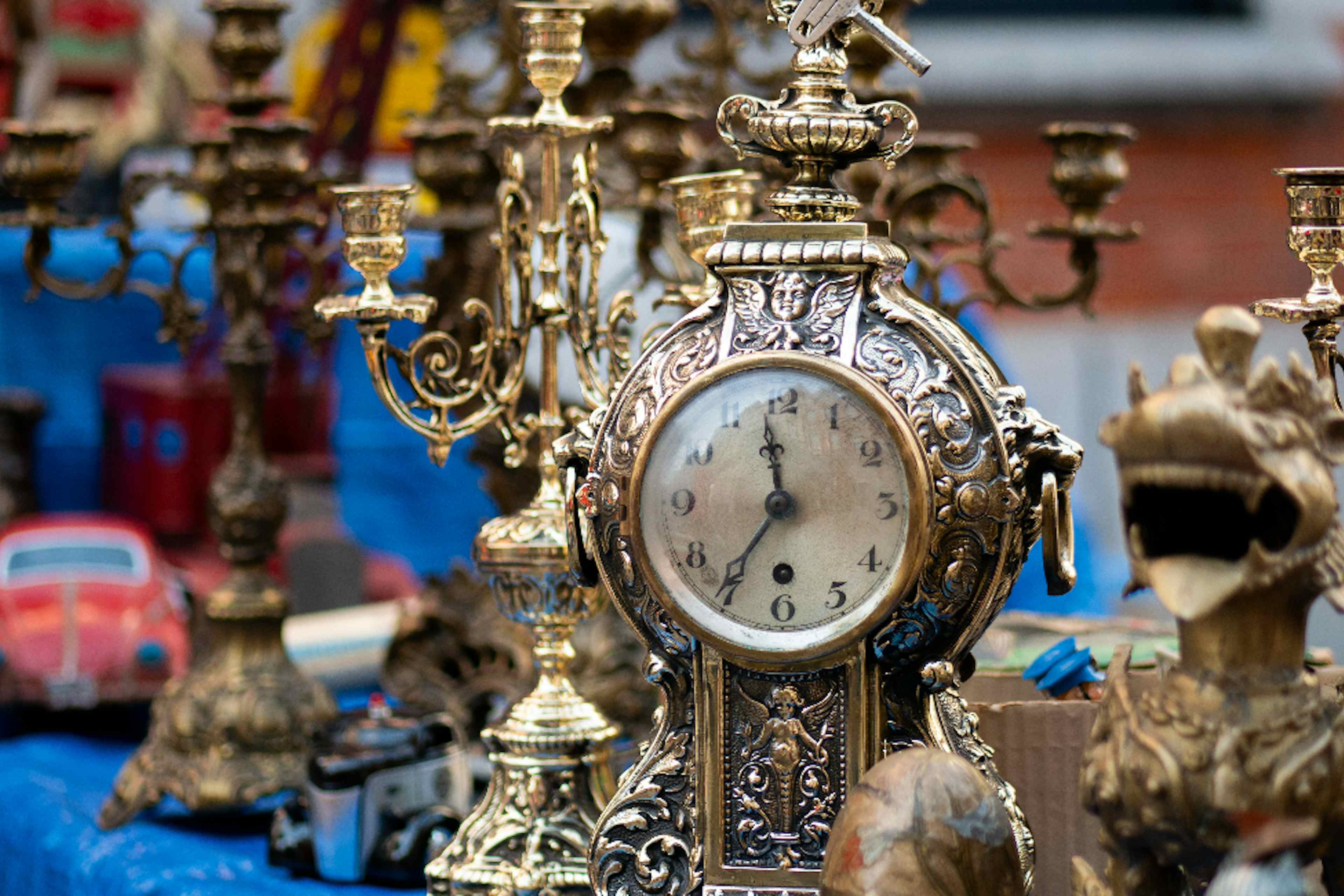 Beautiful brass and golden vintage desktop clocks offered at Vintage Market Days of Blackfoot of the Yellowstone Teton Territory.