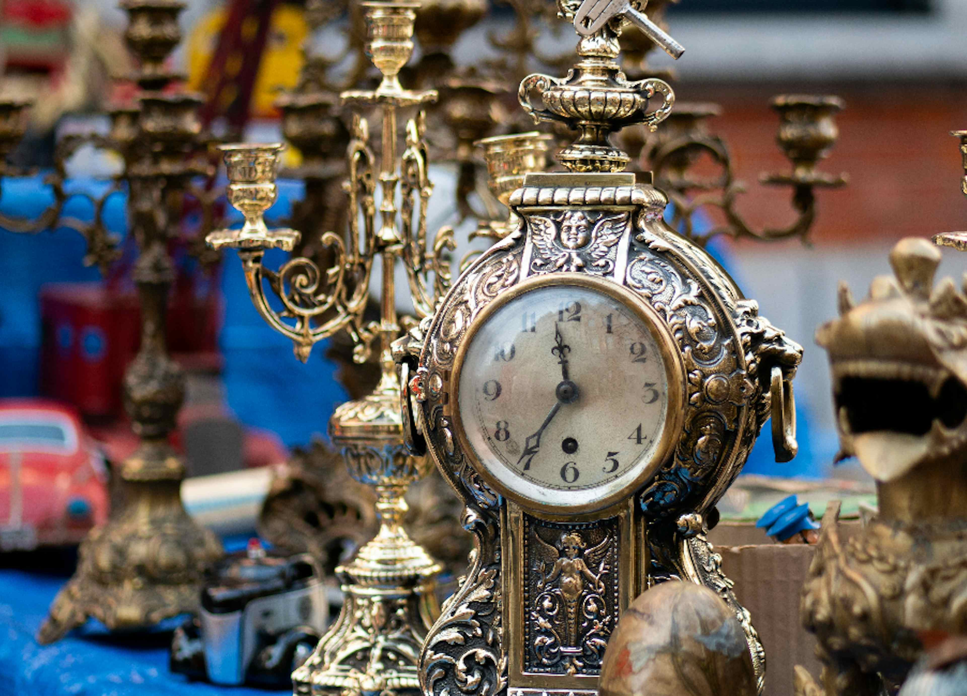 Beautiful brass and golden vintage desktop clocks offered at Vintage Market Days of Blackfoot of the Yellowstone Teton Territory. 