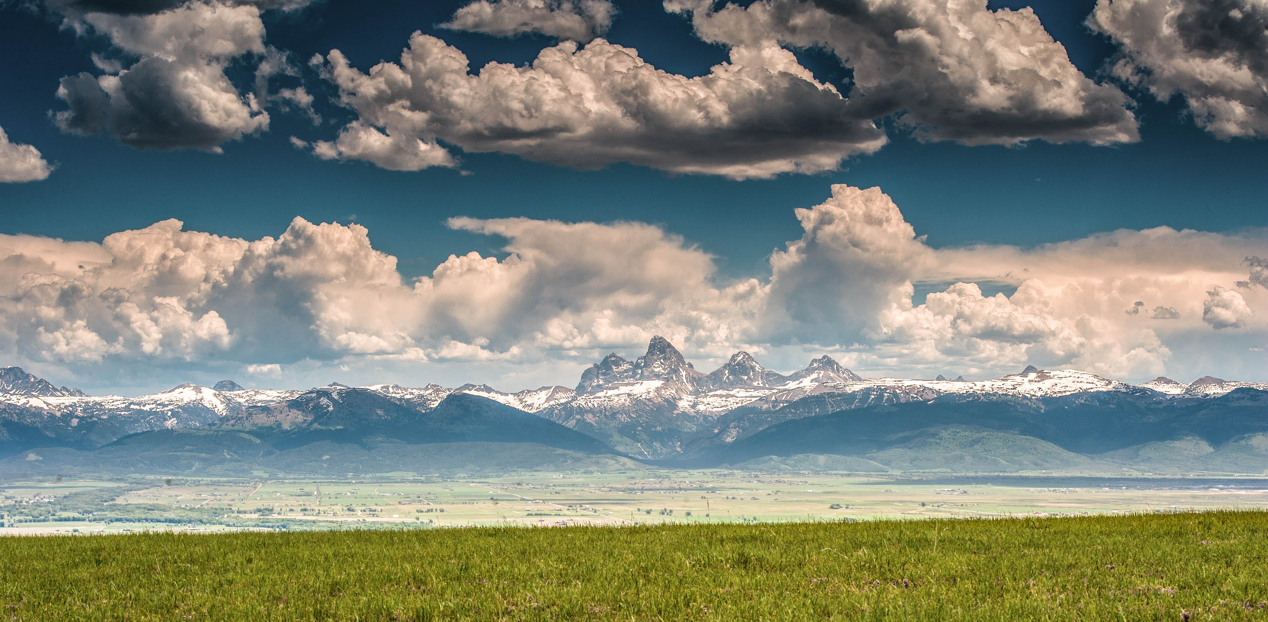 The Teton Mountain Range overlooking Teton Valley in Eastern Idaho, a part of the Yellowstone Teton Territory.