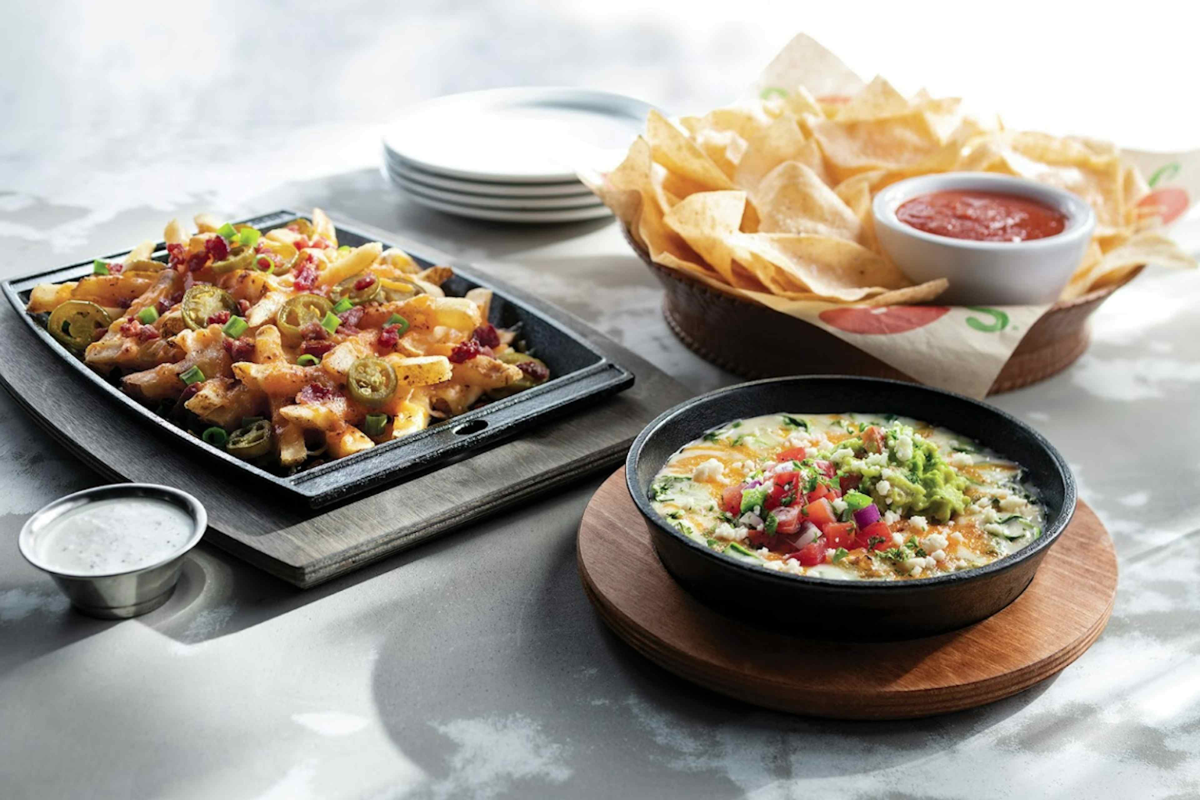 Chips, dip, and bacon fries covered in cheese, all offered at Chili's Grill & Bar of Idaho Falls. 