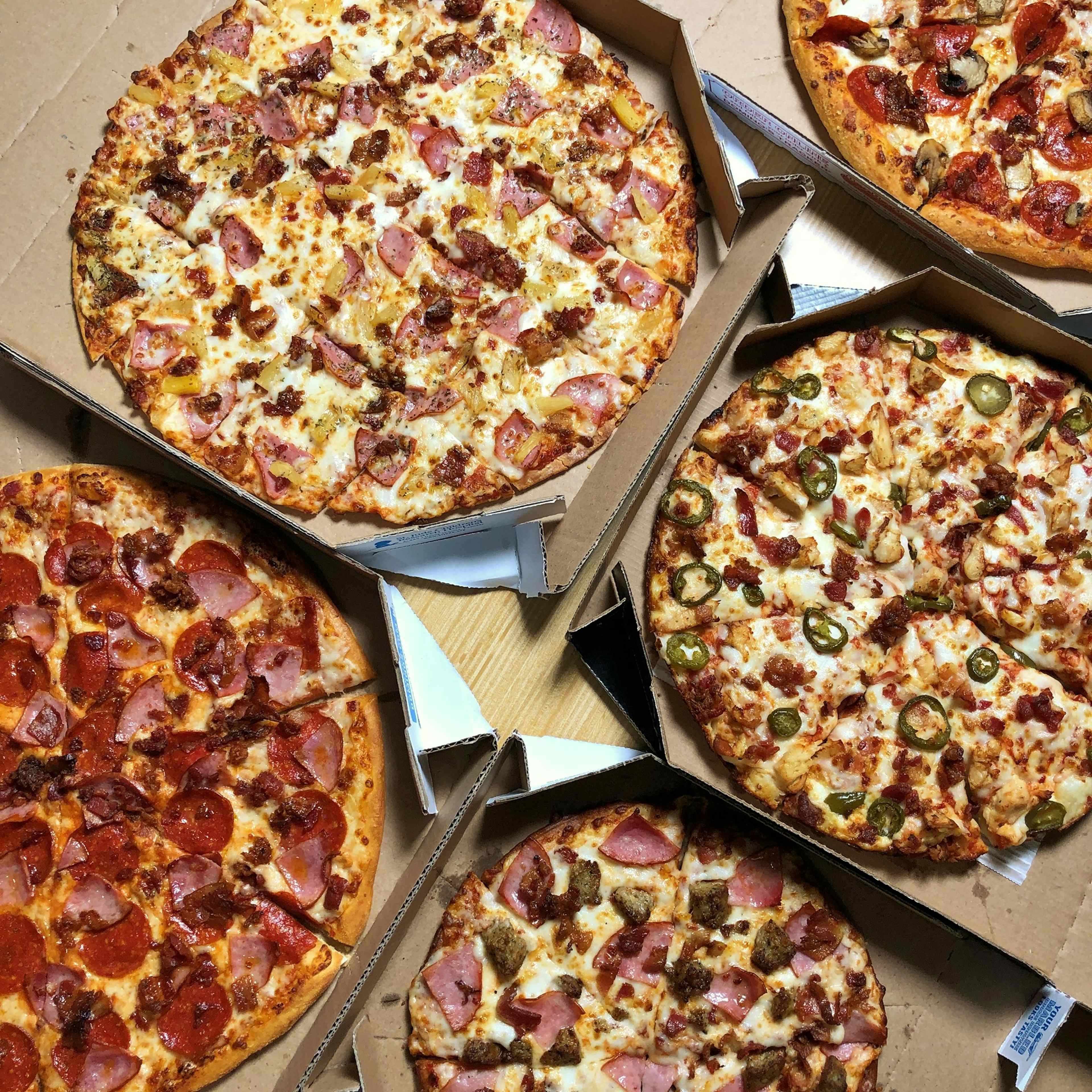 An array of mouthwatering pizzas offered at Domino's of Idaho Falls, located within the Yellowstone Teton Territory. 
