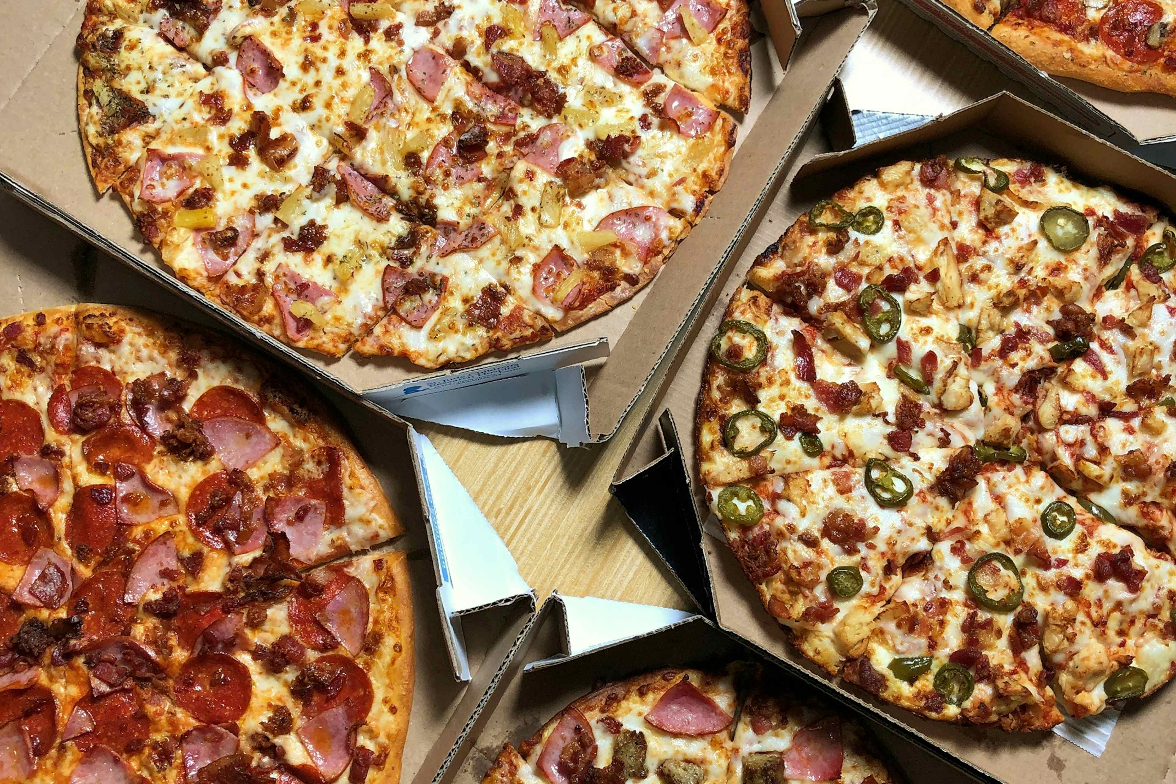 An array of mouthwatering pizzas offered at Domino's of Idaho Falls, located within the Yellowstone Teton Territory. 