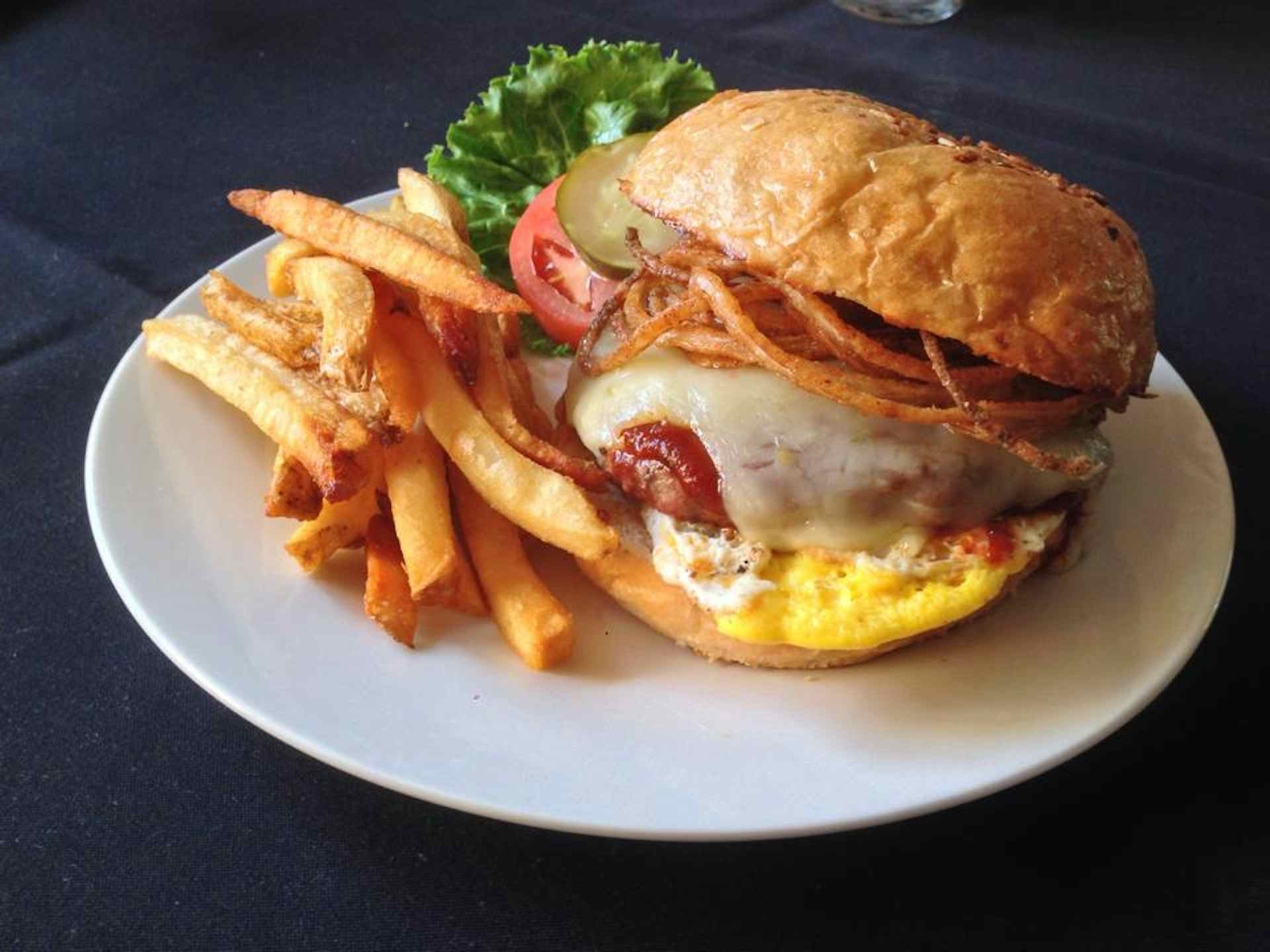 Burger with crispy onions and fresh fries, courtesy of the Snake River Roadhouse of the Yellowstone Teton Territory in Idaho