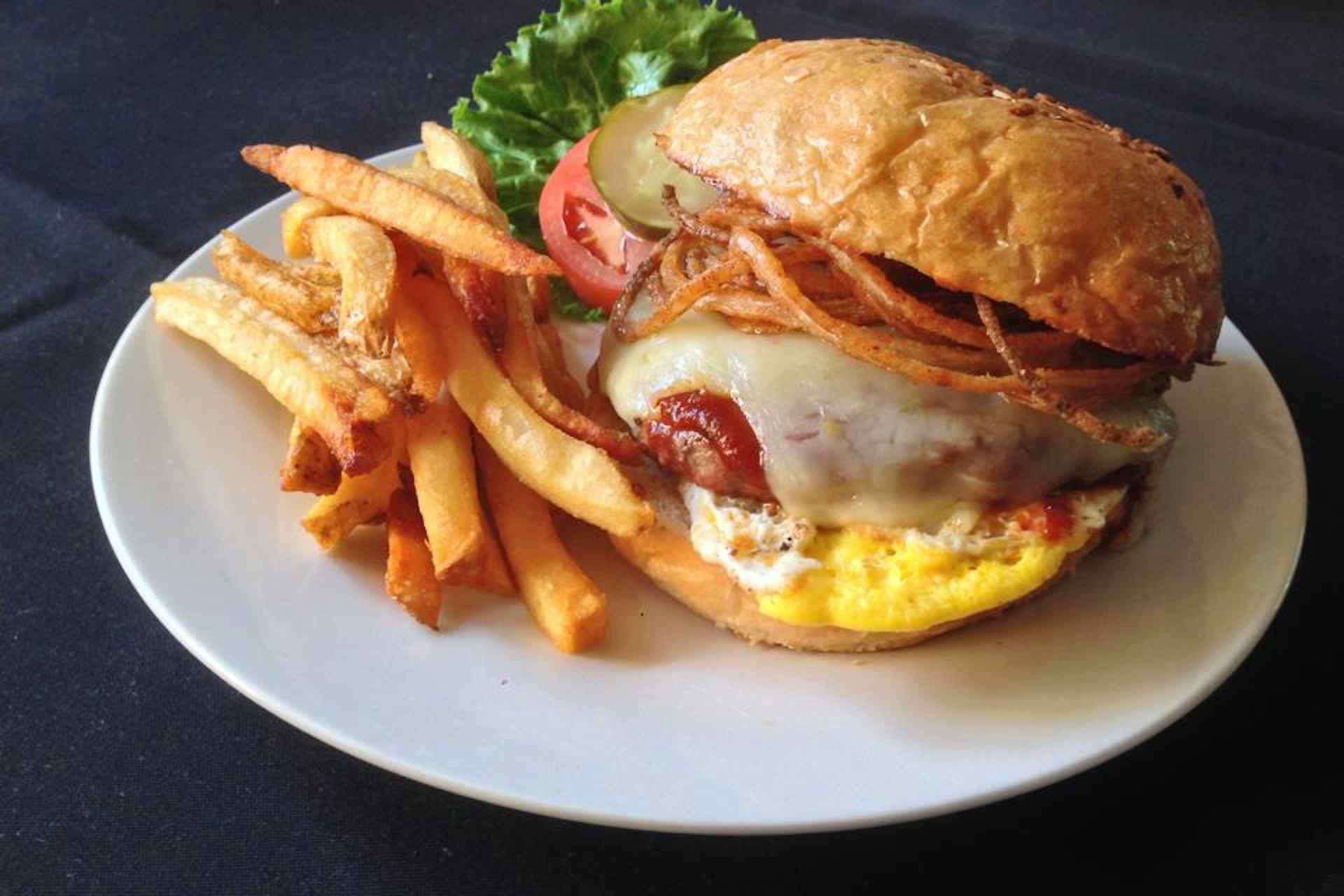 Burger with crispy onions and fresh fries, courtesy of the Snake River Roadhouse of the Yellowstone Teton Territory in Idaho