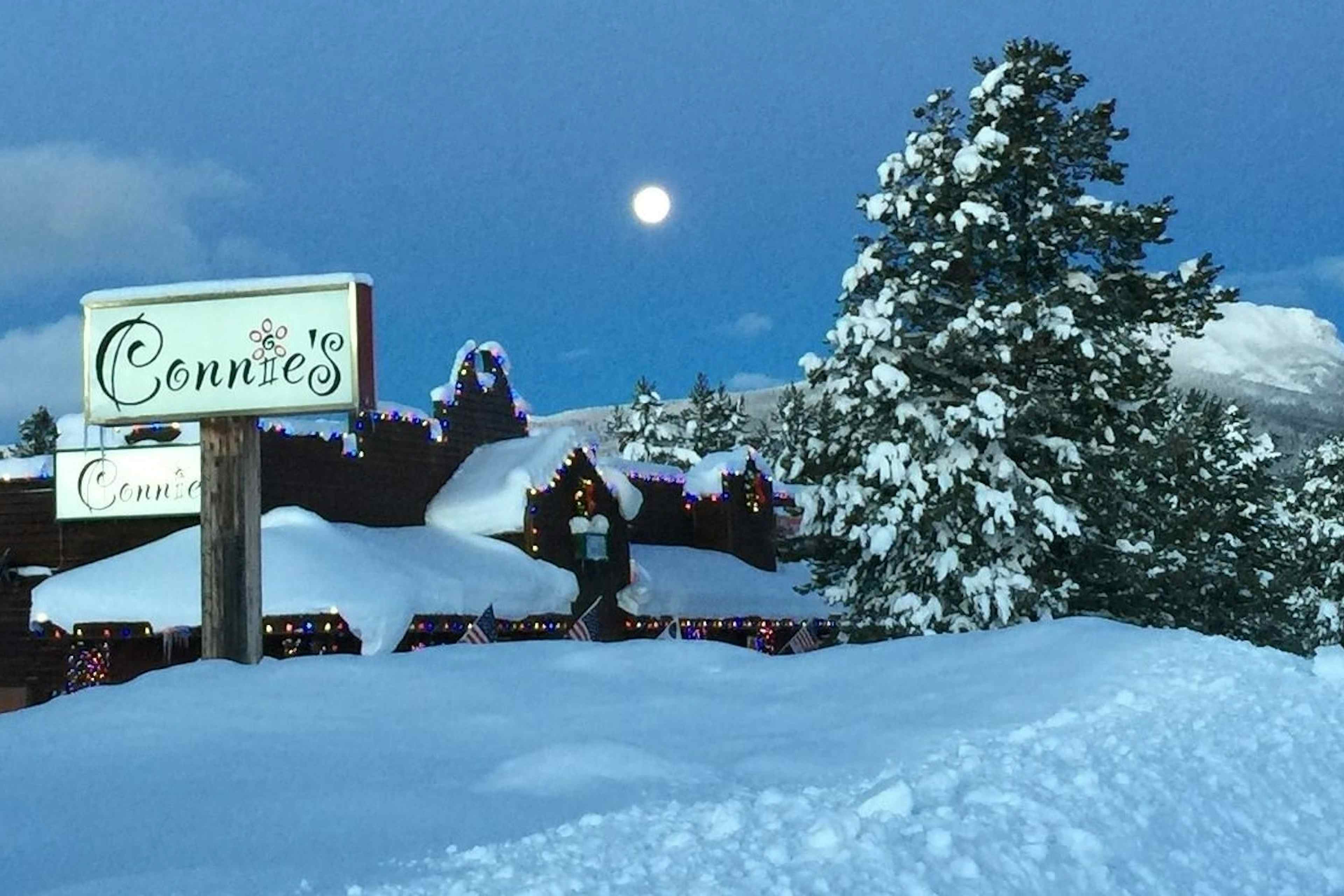 Snow covered external view of Connie's of Island Park, Idaho within the Yellowstone Teton Territory.