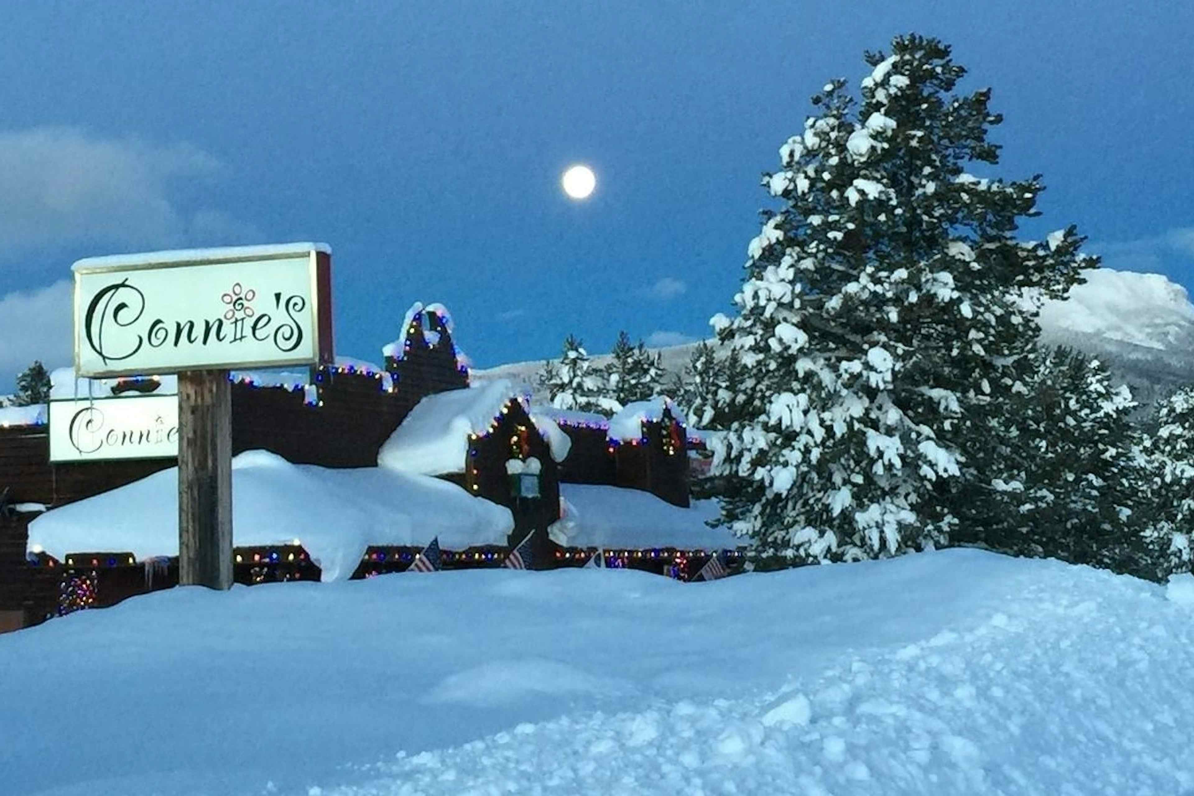 Snow covered external view of Connie's of Island Park, Idaho within the Yellowstone Teton Territory. 