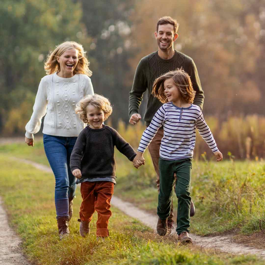 Family runs in a park in Rexburg, ID, a part of Yellowstone Teton Territory in Eastern Idaho.