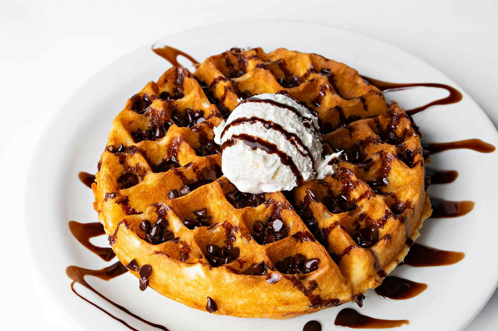 Toasty housemade waffle with melted chocolate chips, chocolate syrup, and fluffy whipped cream at Smitty's Pancake & Steak House near historic downtown Idaho Falls of the Yellowstone Teton Territory.