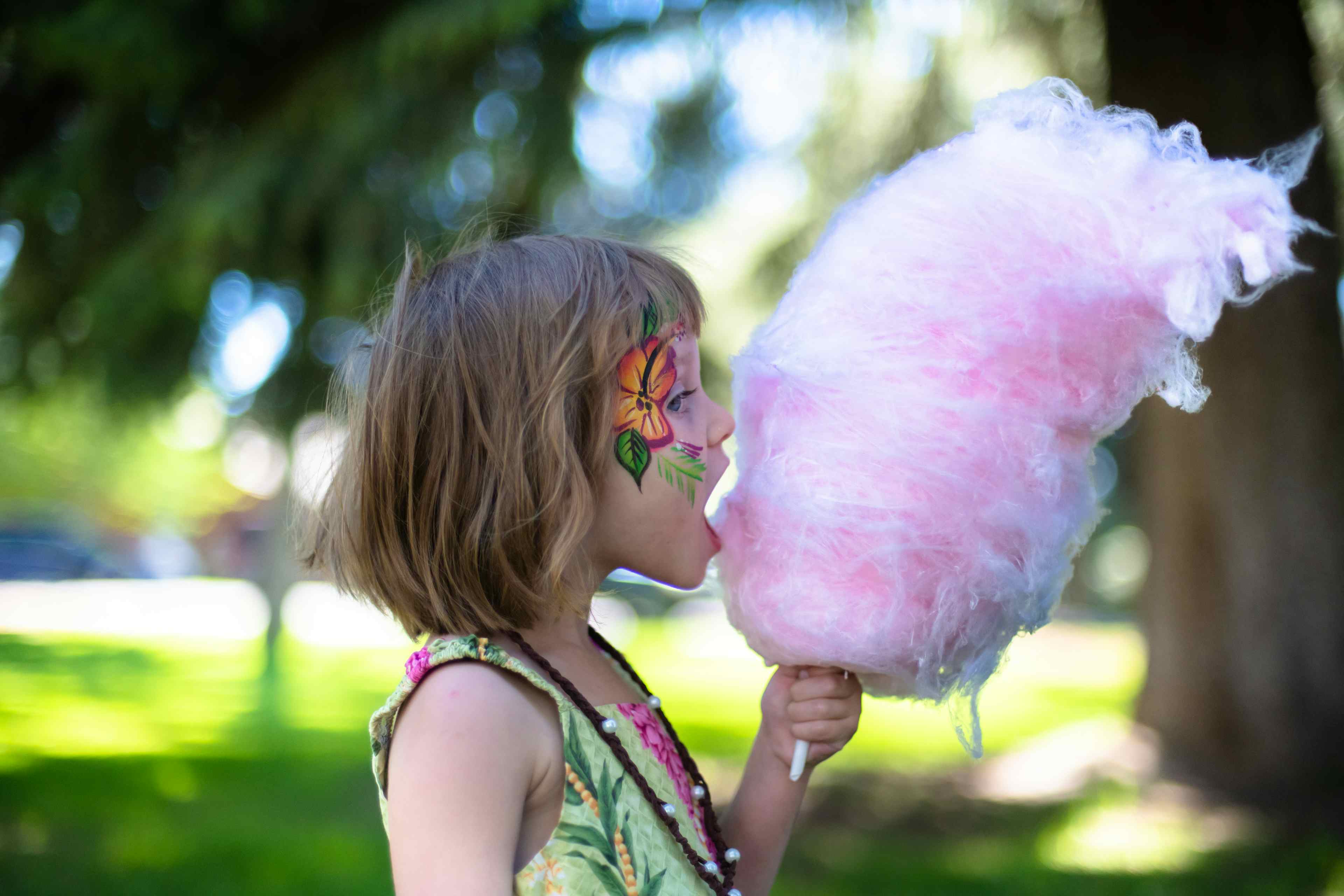 A young girls eats cotton candy at Music on Main in Victor Idaho, a part of Eastern Idaho and Yellowstone Teton Territory.