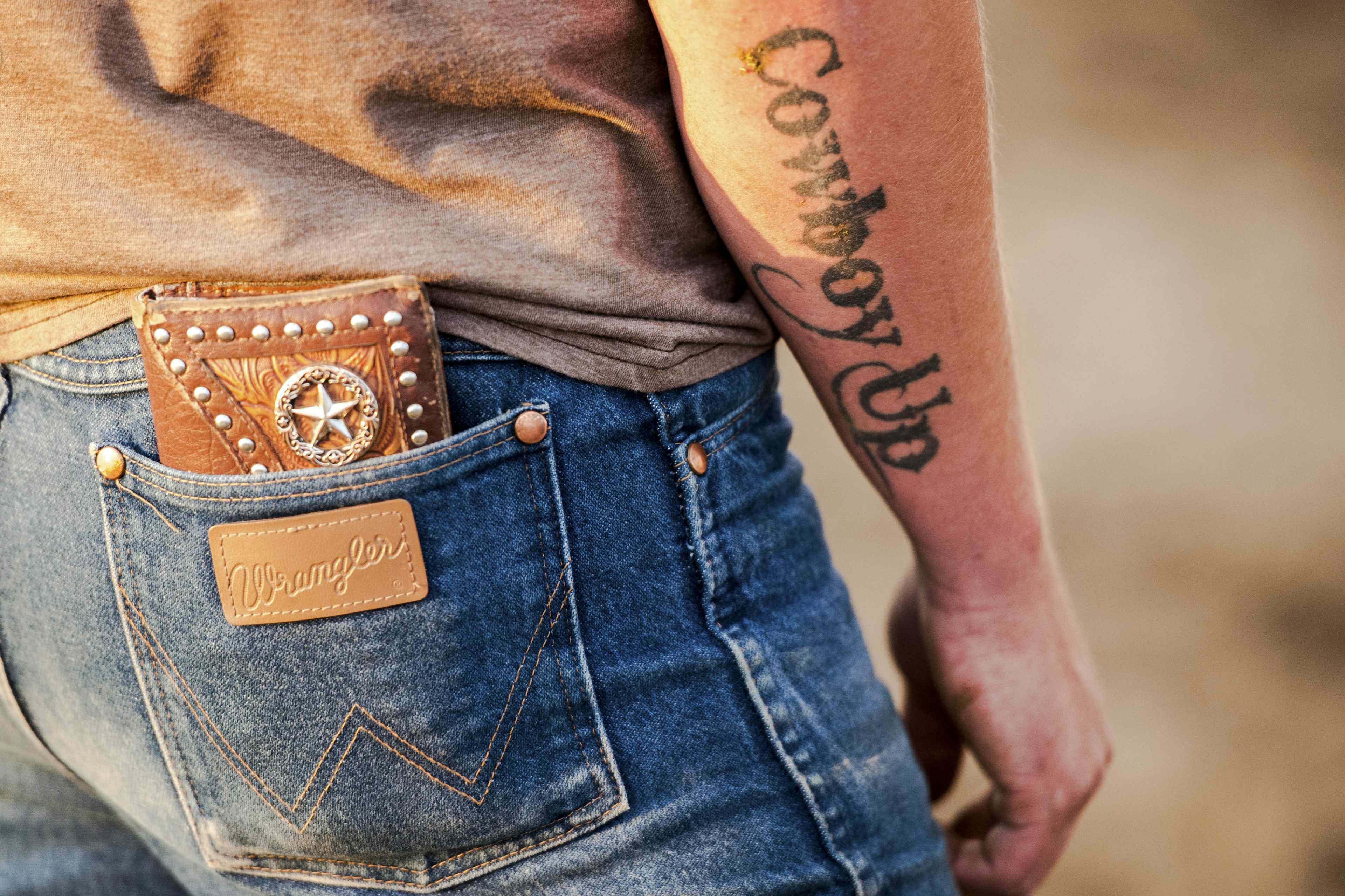 Cowboy Up tattoo at Teton Valley Rodeo in Eastern Idaho, a part of Yellowstone Teton Territory.