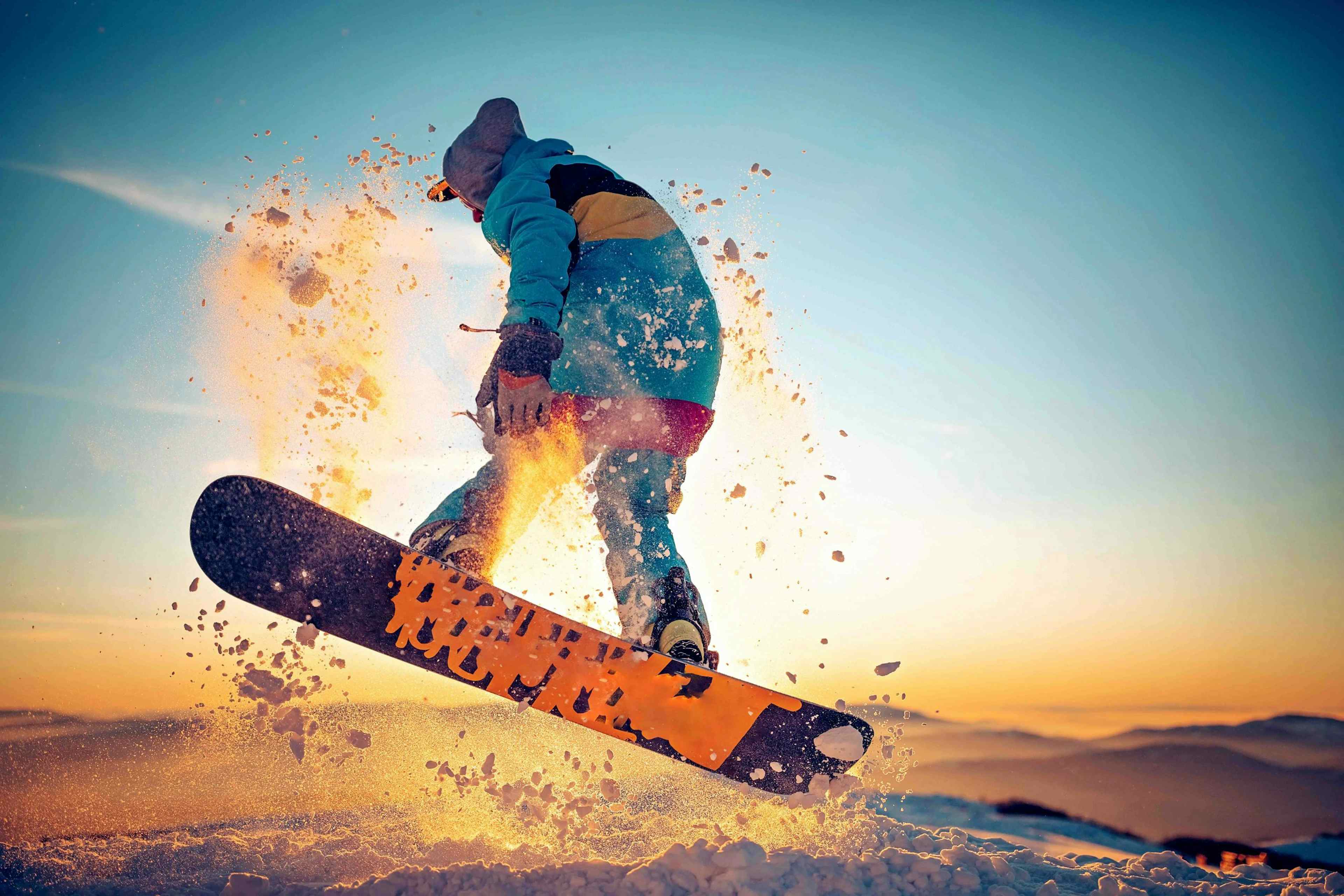 Snowboarder cruising on fresh powder that can be found at Kelly Canyon Ski Resort outside of Ririe, Idaho of the Yellowstone Teton Territory and Targhee National Forest.