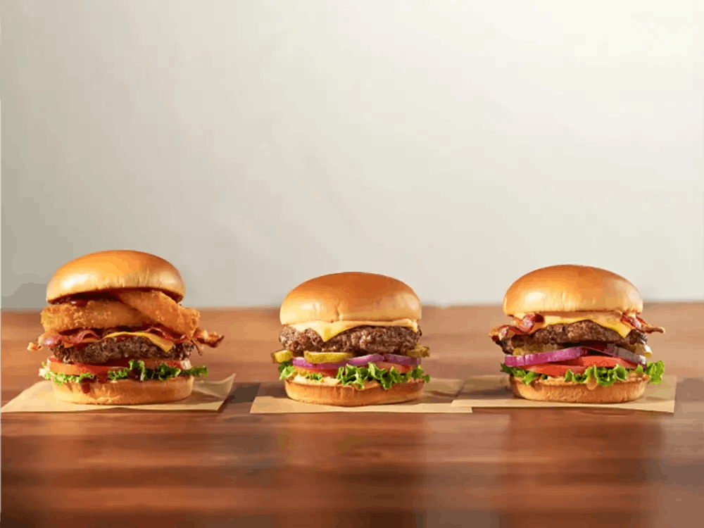 IHOP of Ammon, Idaho offers more than just pancakes! Featured are delicious burgers with bacon, tomato, and onion rings.