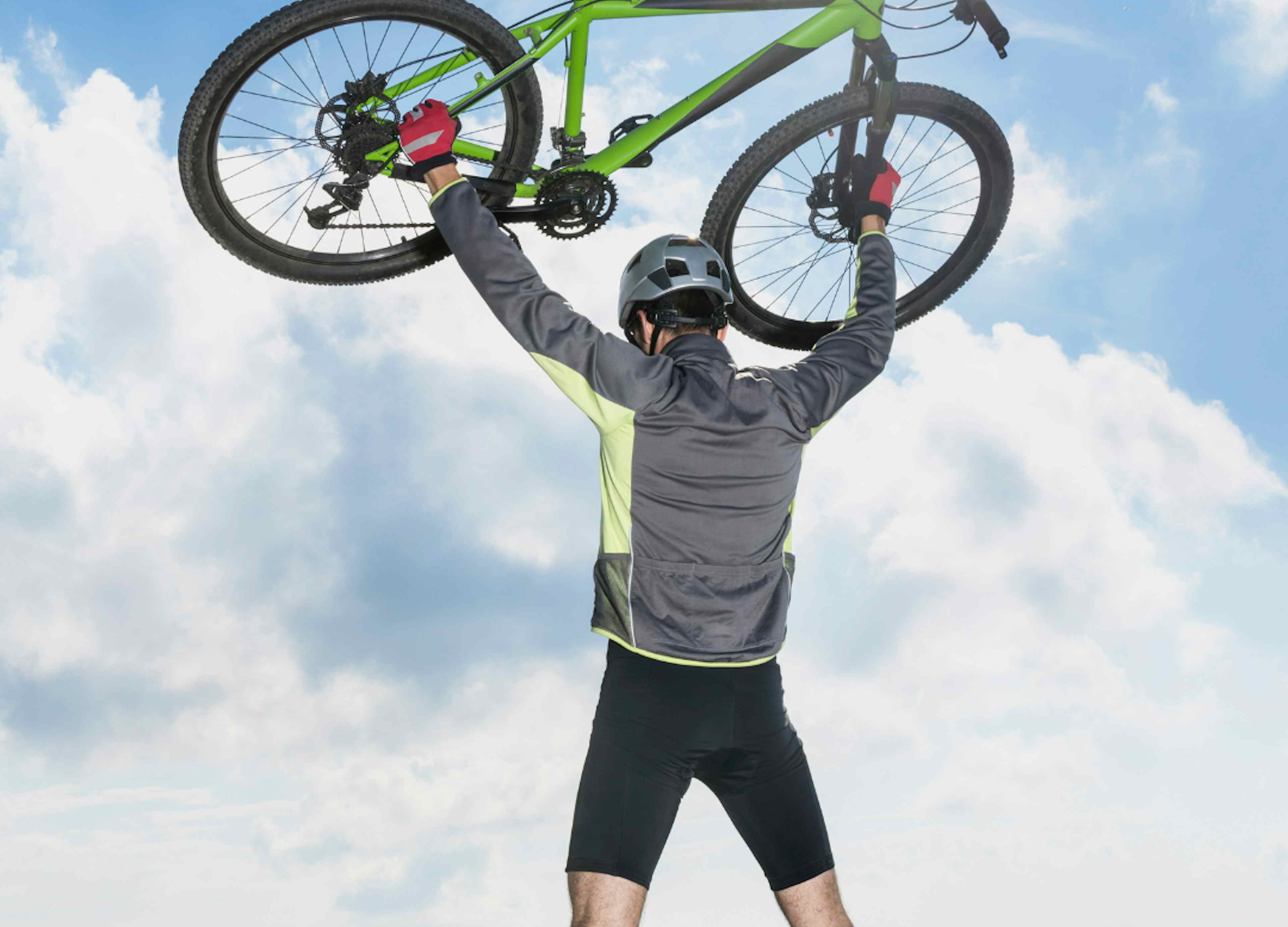 A biker lifts his bike in Ashton Idaho, a part of Eastern Idaho and Yellowstone Teton Territory.