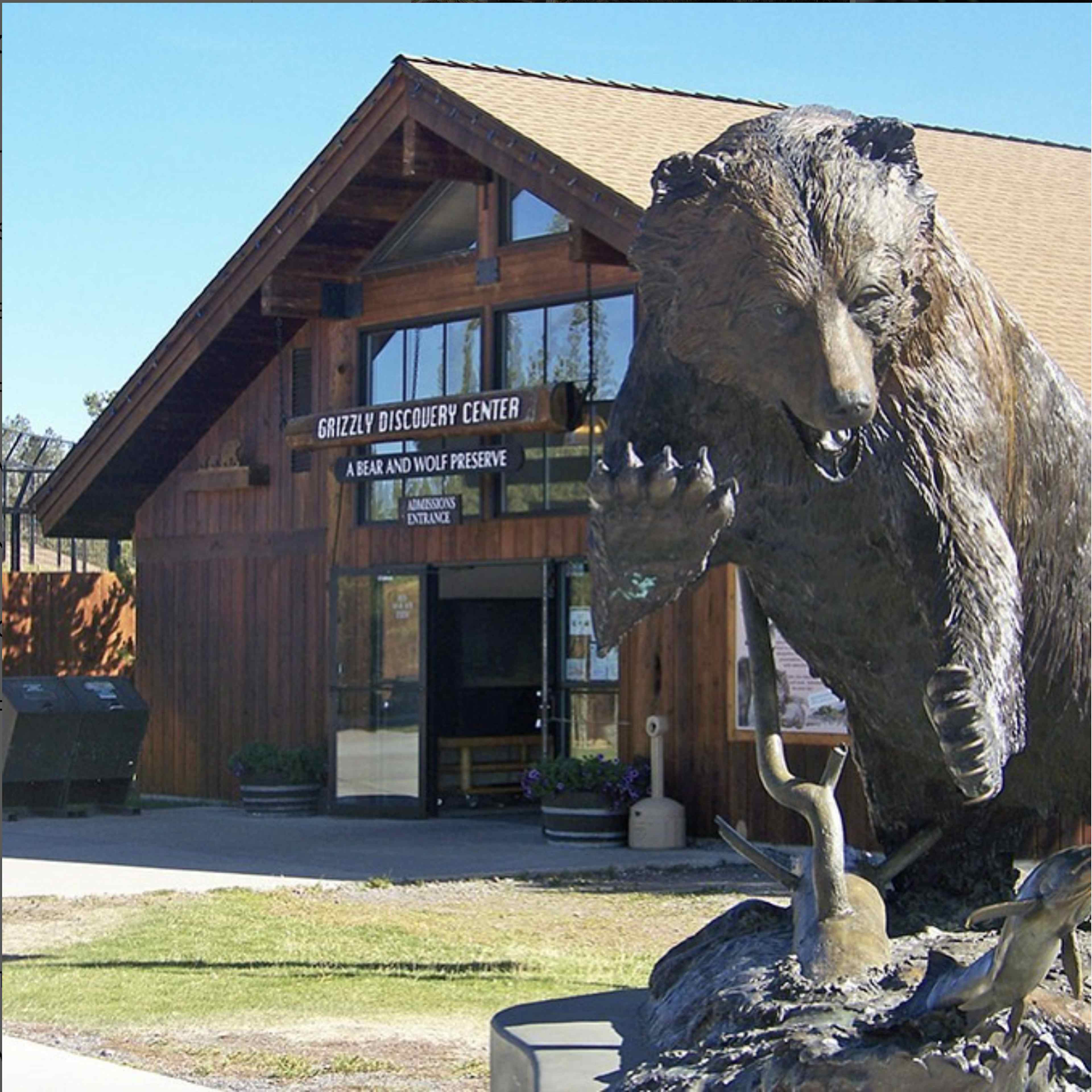 Front of the building with a bear sculpture