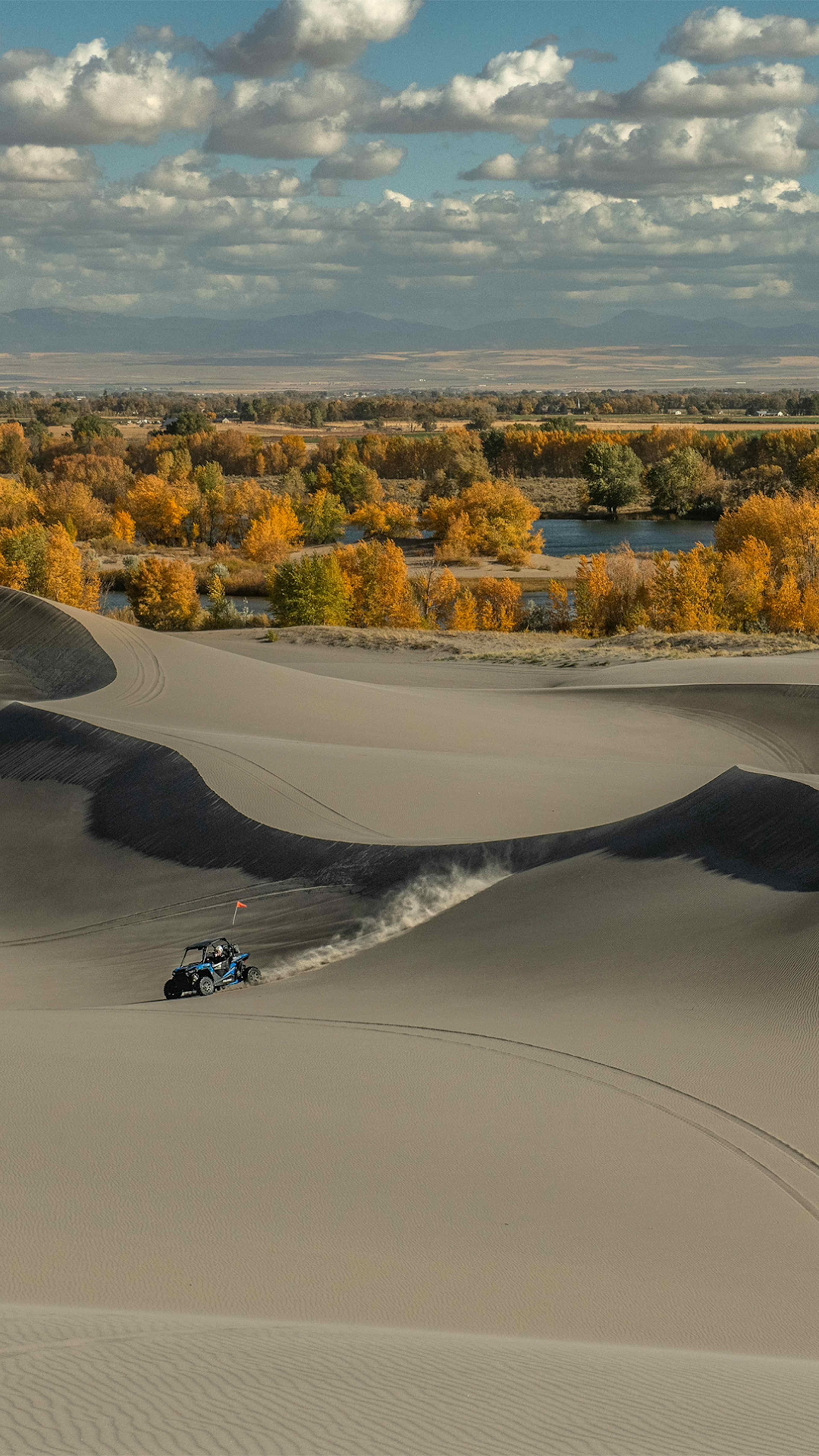 An ATV races the sand dunes in St. Anthony, Idaho.