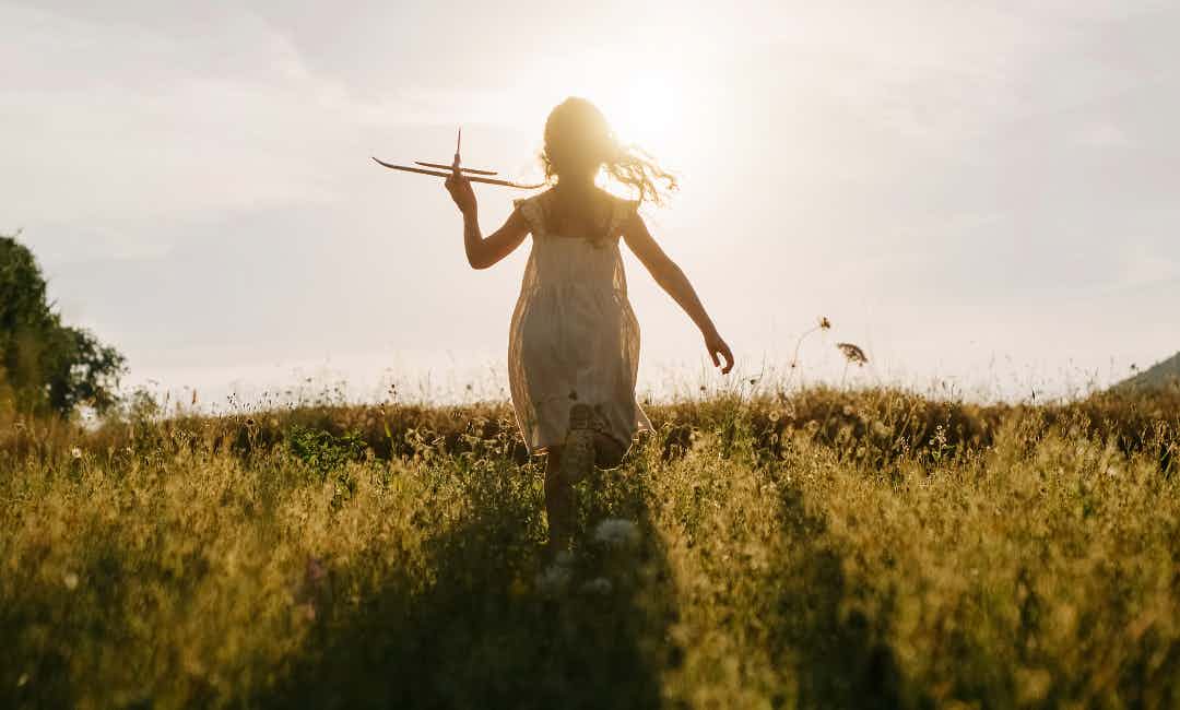A girl runs through Rigby/Ririe area of Yellowstone Teton Territory.