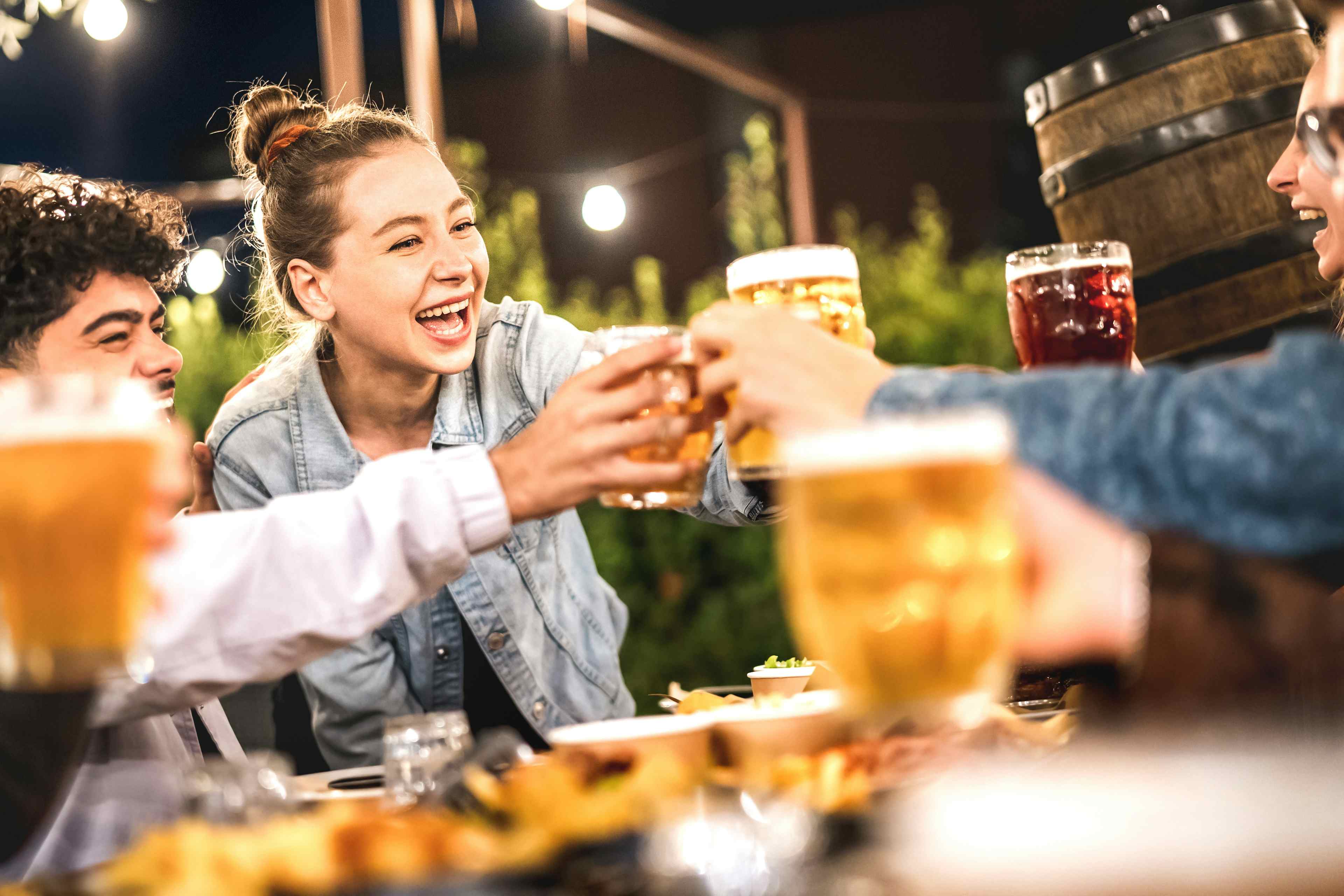 A group of friends toast with beer at a brewery in Idaho Falls, ID.