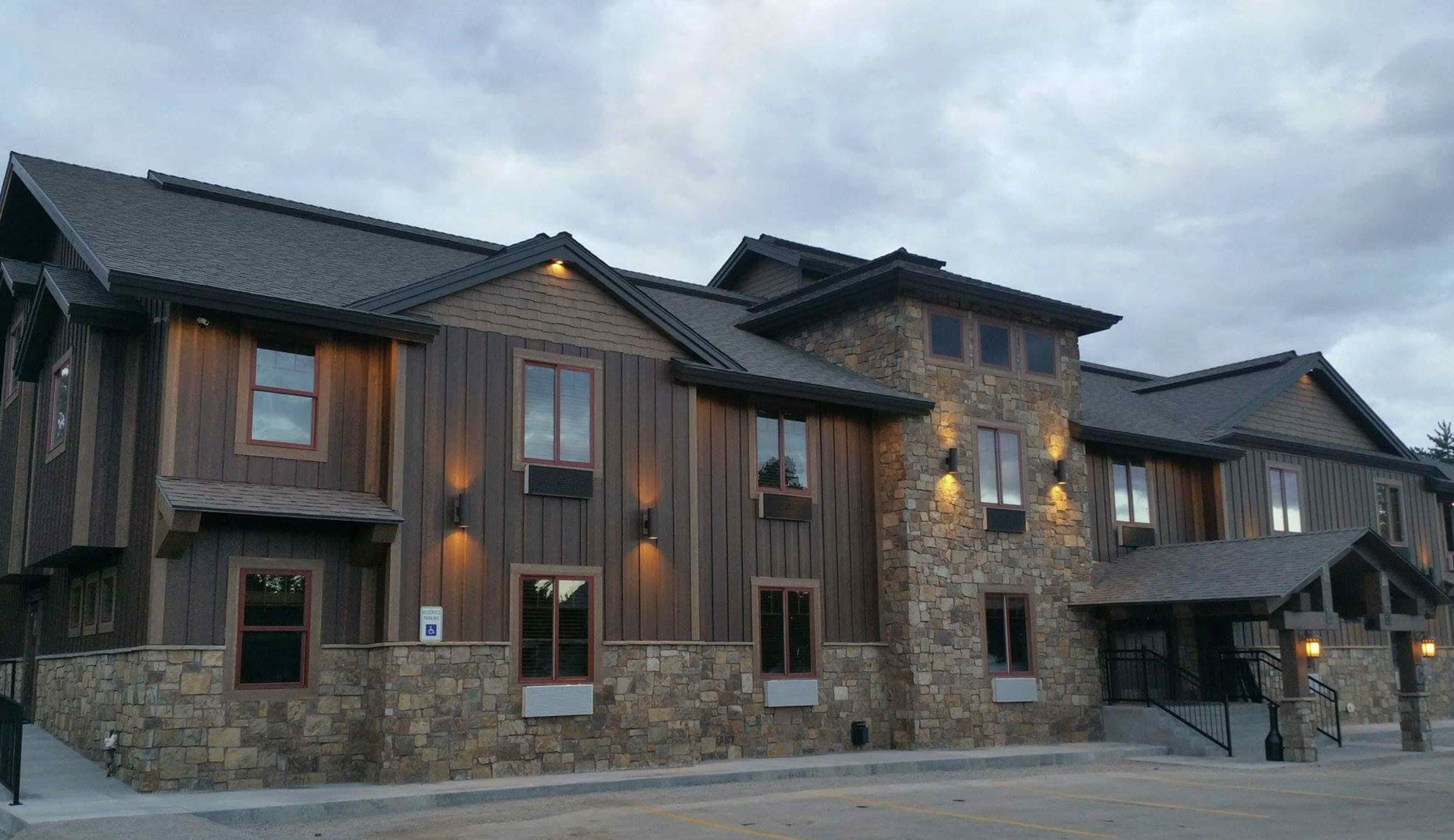 A photograph capturing an exterior view of a section of the resort on a refreshing summer night.