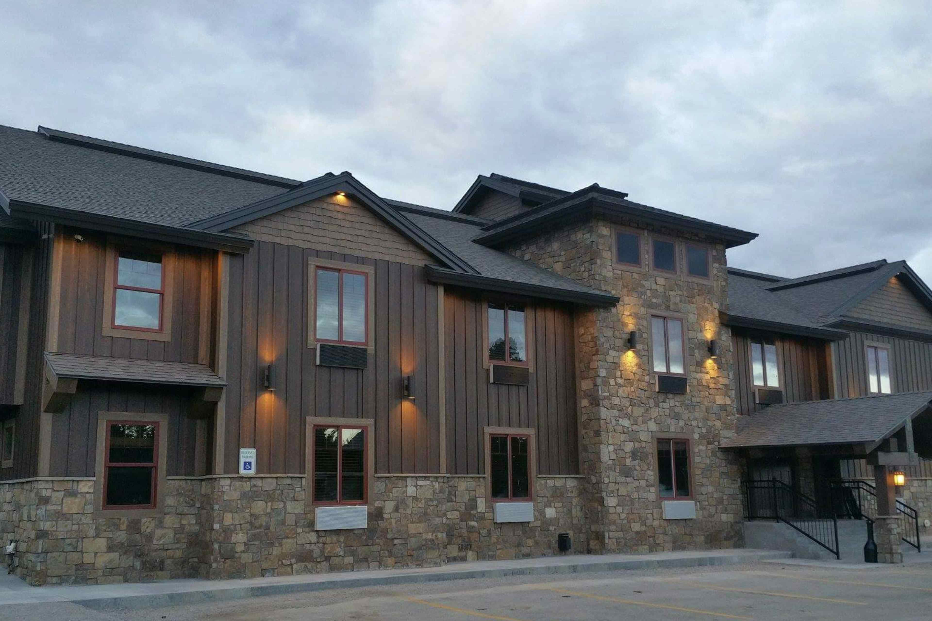 A photograph capturing an exterior view of a section of the resort on a refreshing summer night.