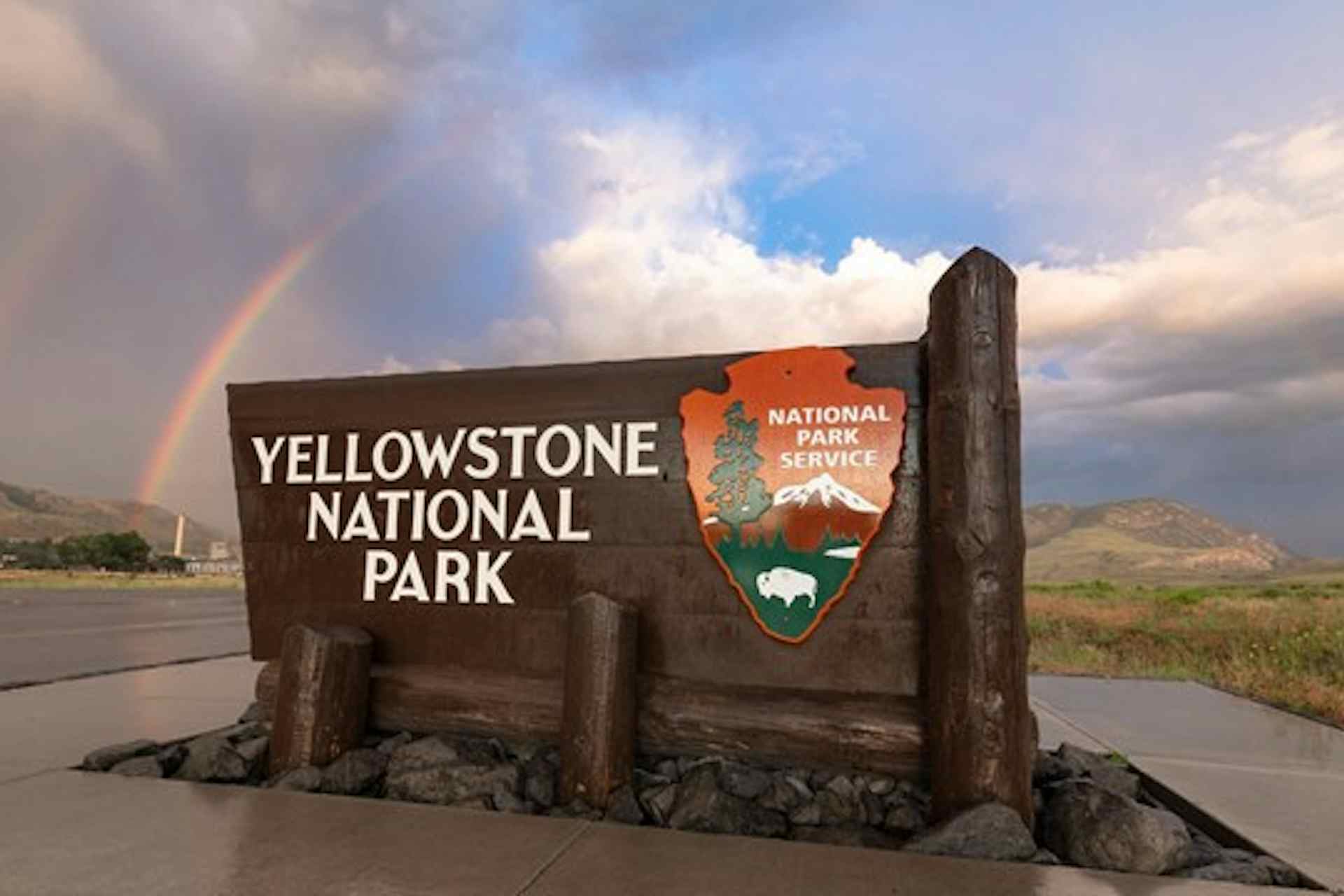 Sign at Yellowstone National Park entrance in Yellowstone Teton Territory.