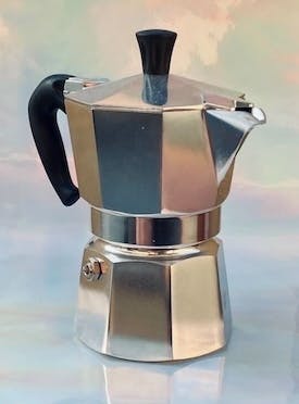 A Moka Pot coffee brewer. It is made from aluminum and is designed to be used directly on a stovetop or an open flame.