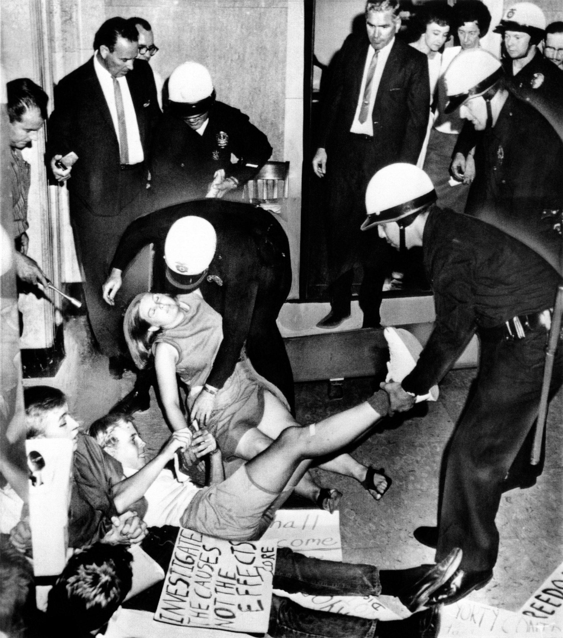 Congress of Racial Equality sit-ins at Los Angeles City Hall. Police arrest 16 protesters demanding the resignation of police