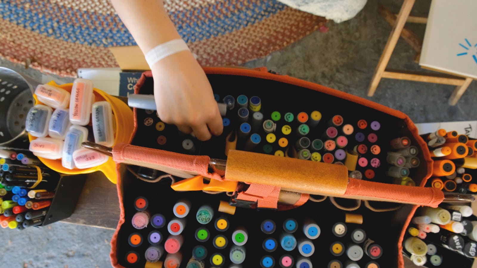 a large canvas case full of chunky colorful markers belonging to Dayna Bowers, visual facilitator